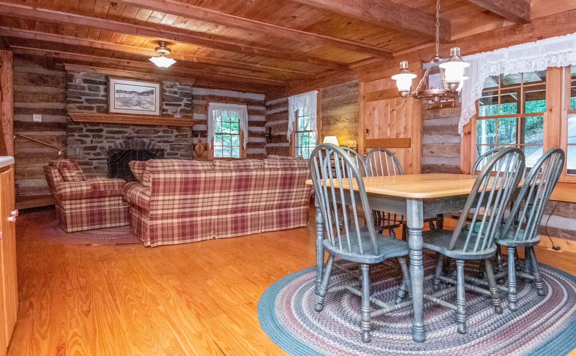 Pine beamed ceilings and wood flooring add to the country charm.