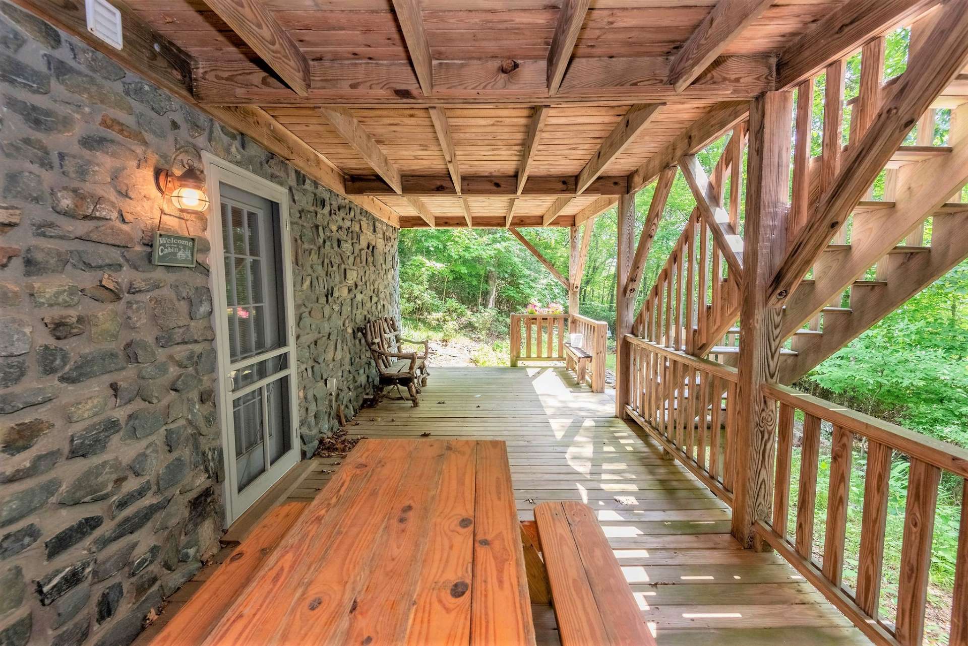 Lower deck is covered and shares a stairway with main level porch.