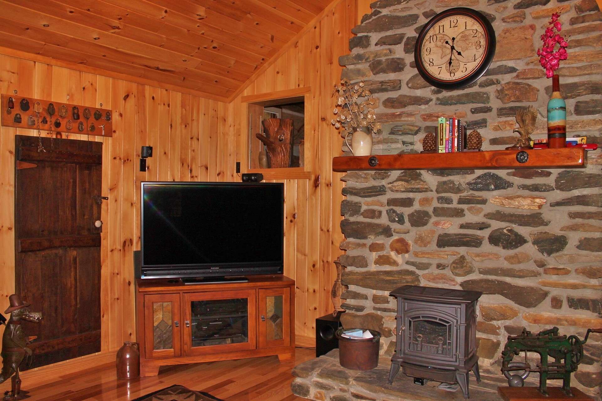 A propane stove provides additional warmth if needed on those cool winter evenings. A laundry room located between the kitchen and master bedroom completes the main level.