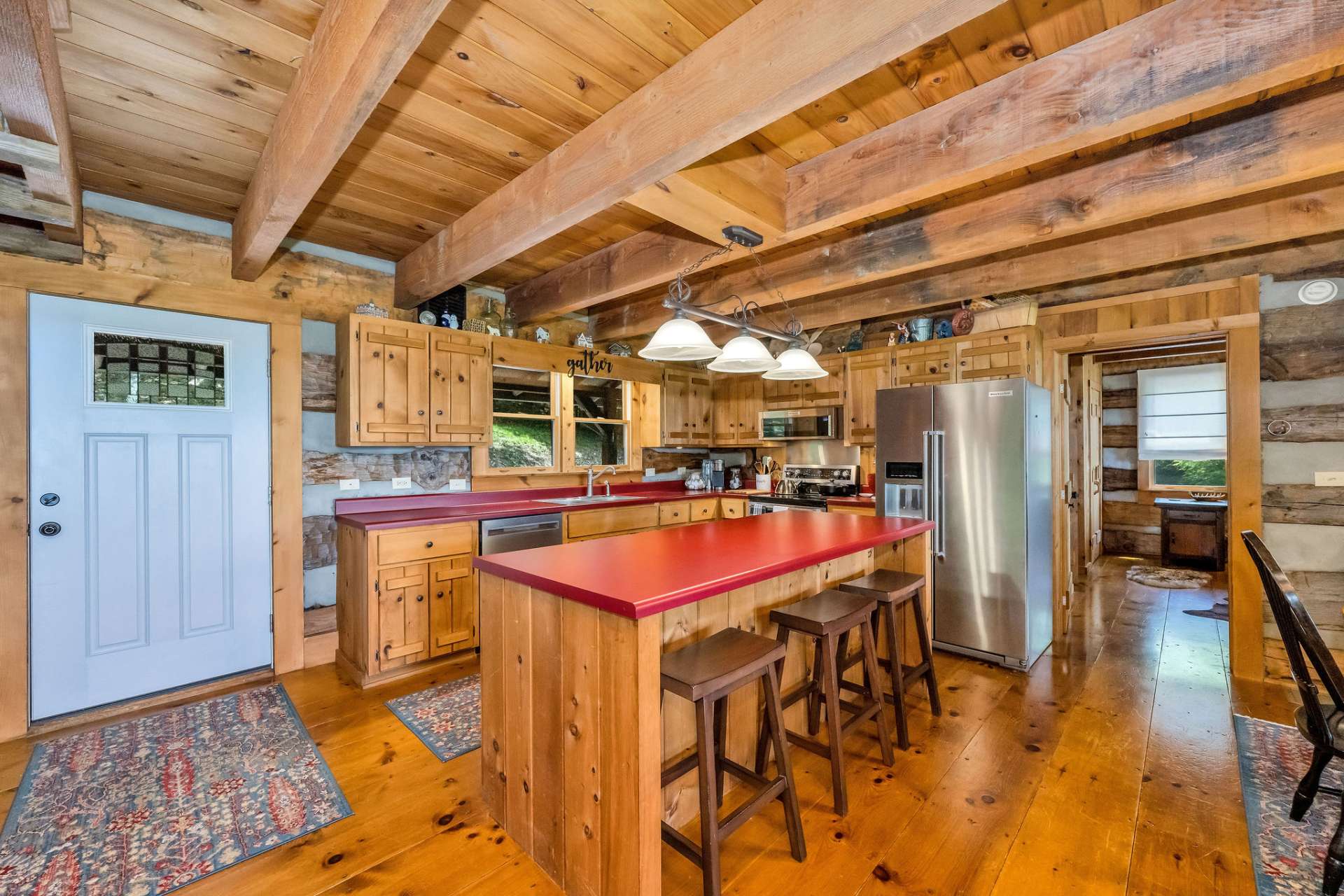 The versatile island offers a serving space, gathering spot, and casual dining area.