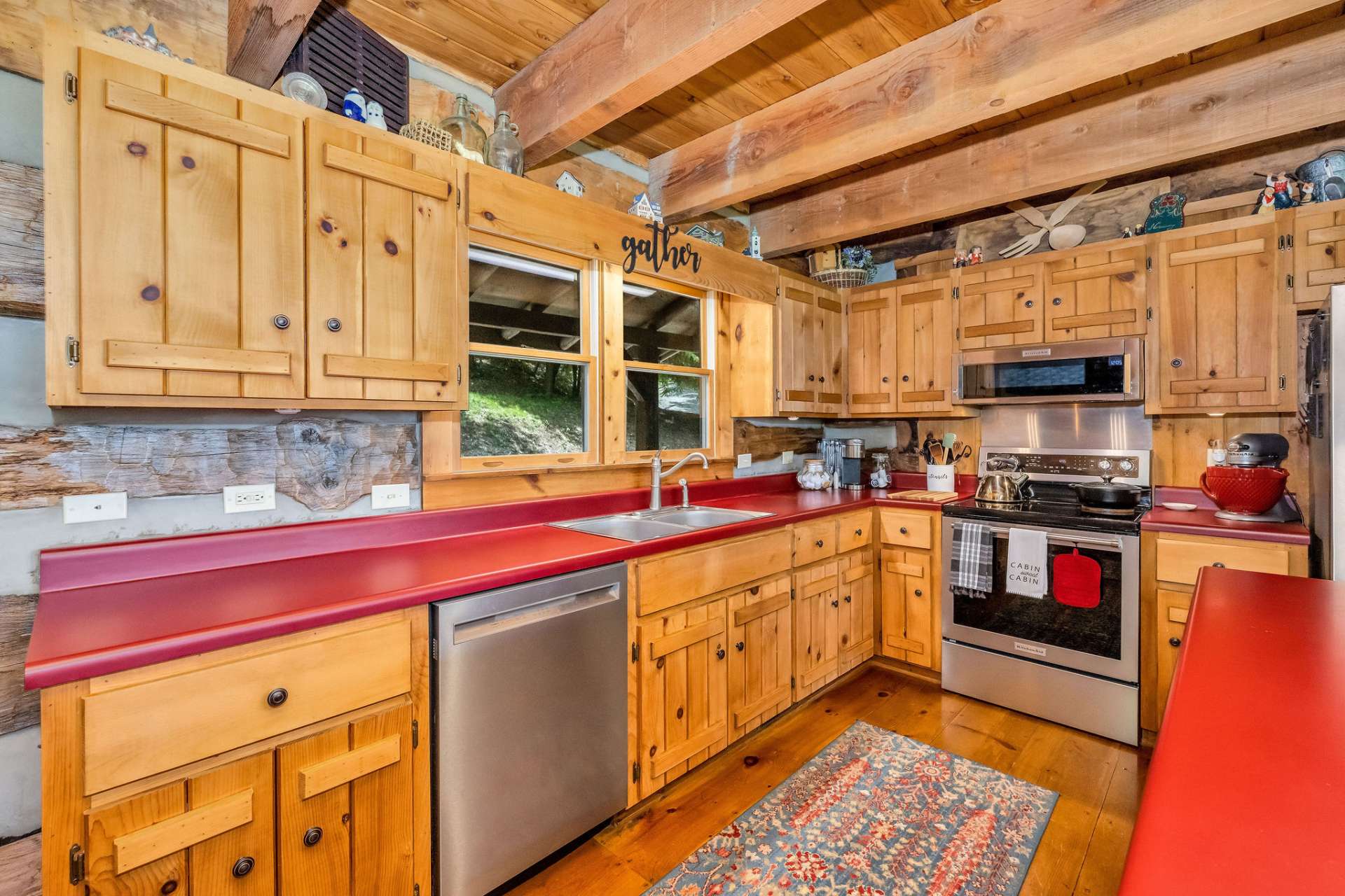 The stylish kitchen offers abundant counter space, custom cabinets, and stainless steel appliances.