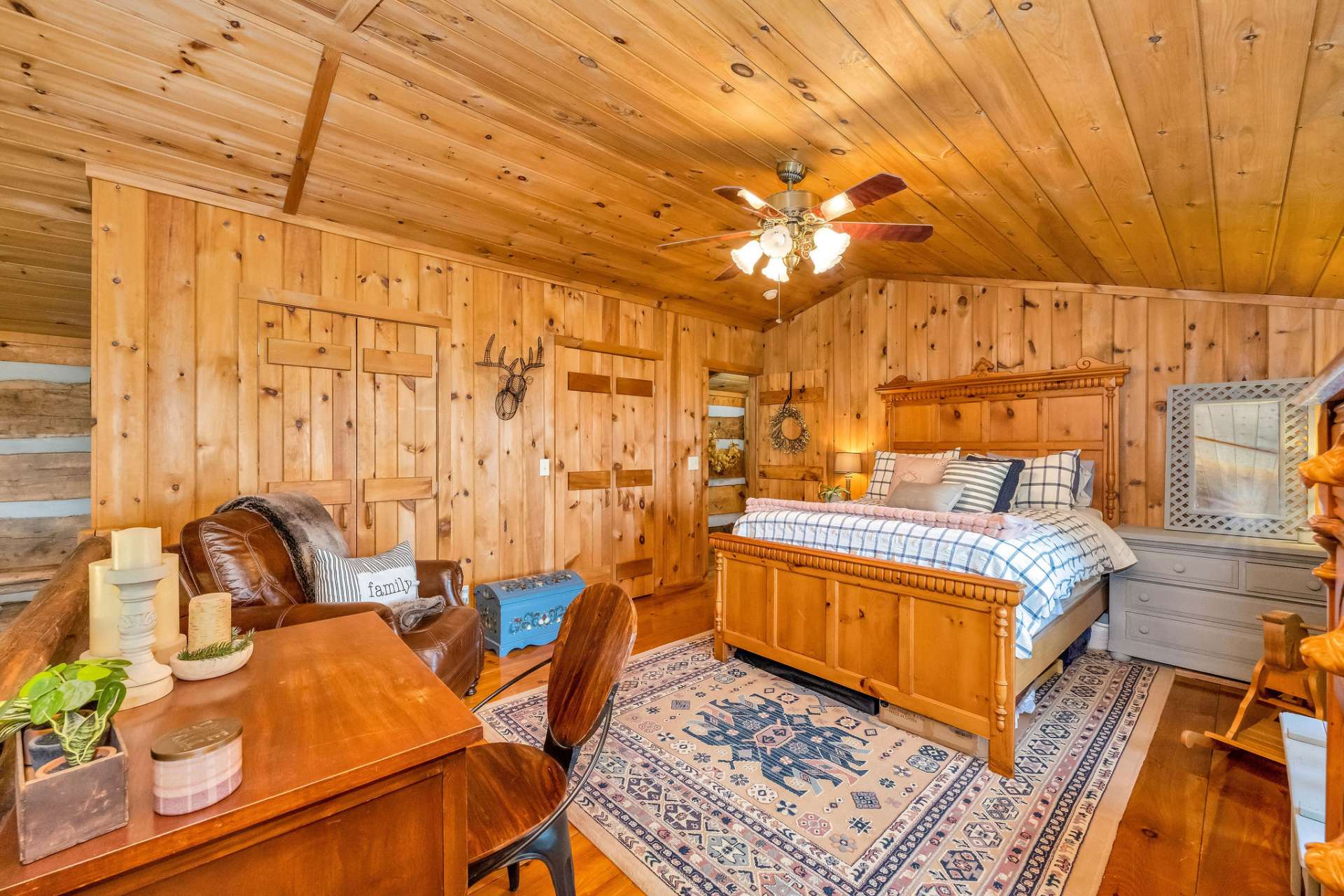 This loft bedroom offers double closets and vaulted ceilings.