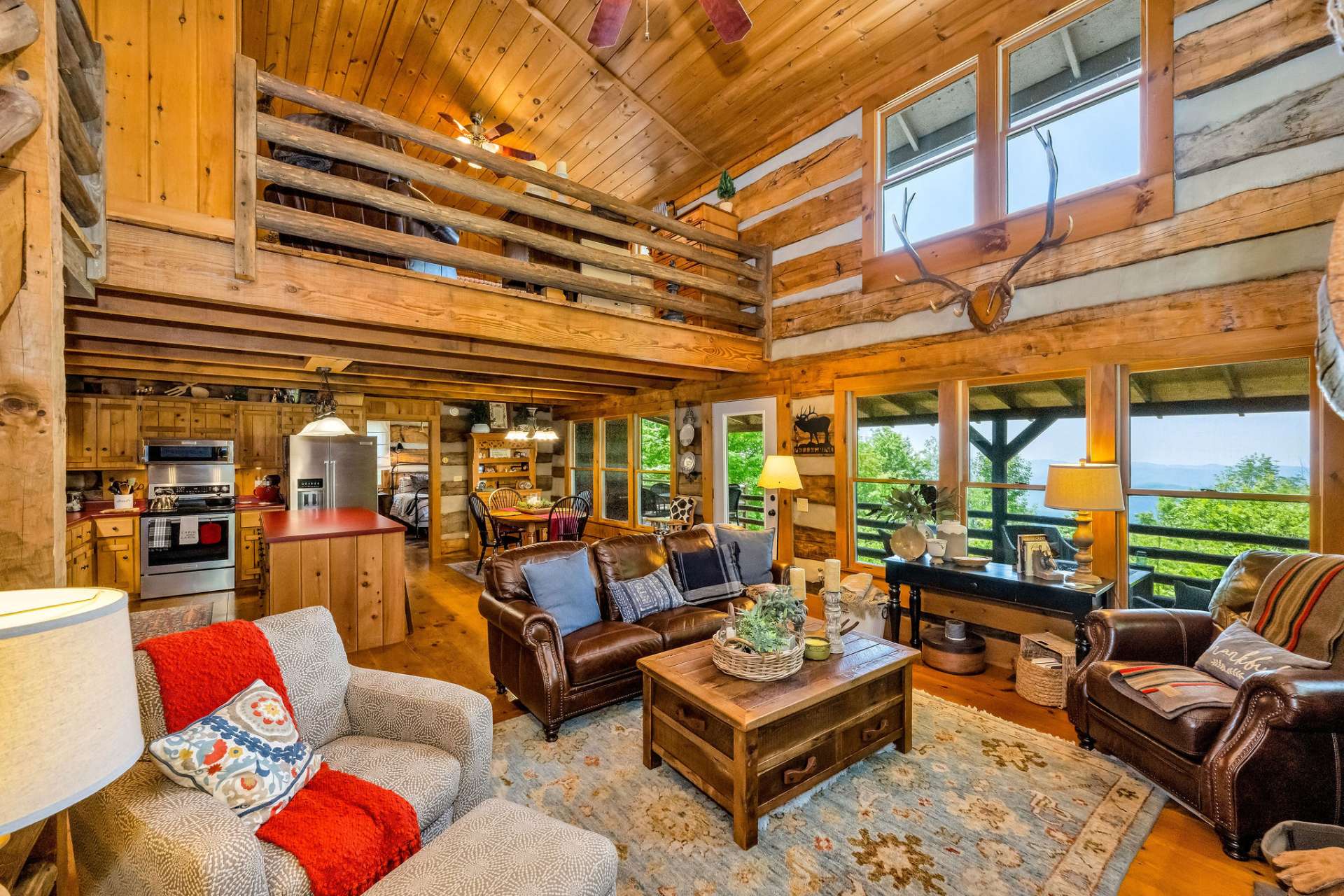 Expansive windows flood the space with natural light and frame breathtaking mountain ridges from every angle.