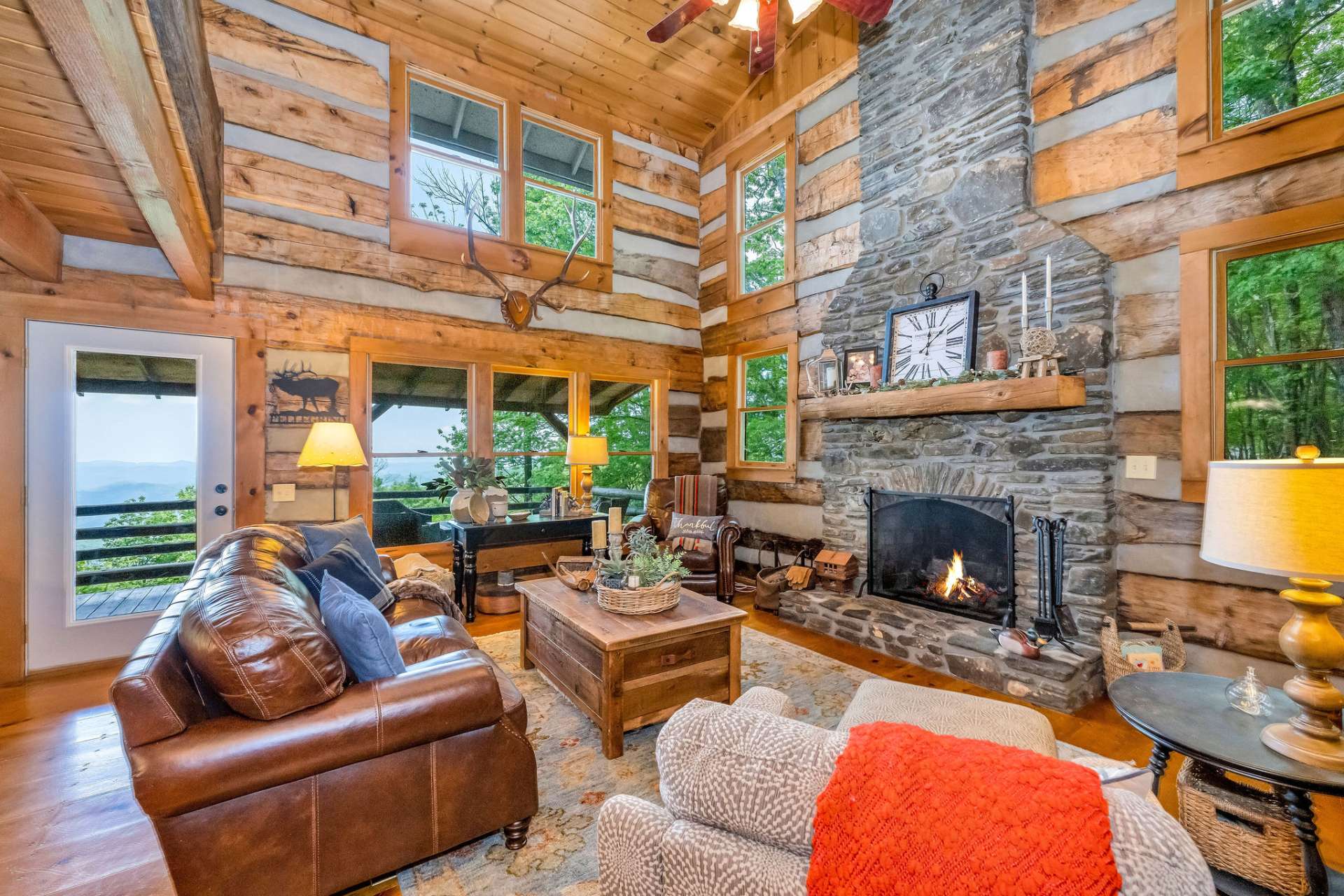 Expansive windows flood the space with natural light and frame breathtaking mountain ridges from every angle.