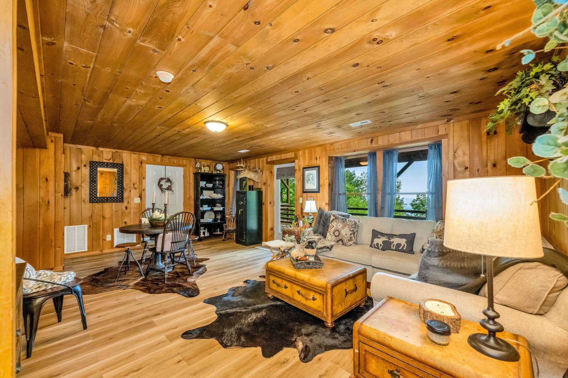 The lower level family room offers a versatile space for relaxing and playing games.