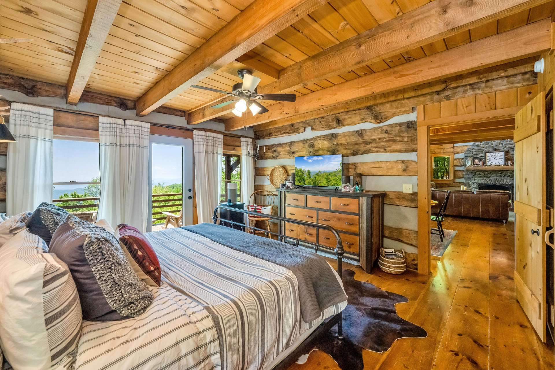 A dreamy primary bedroom awaits you, where you can wake up to ridge lines and fall asleep under the evening stars.