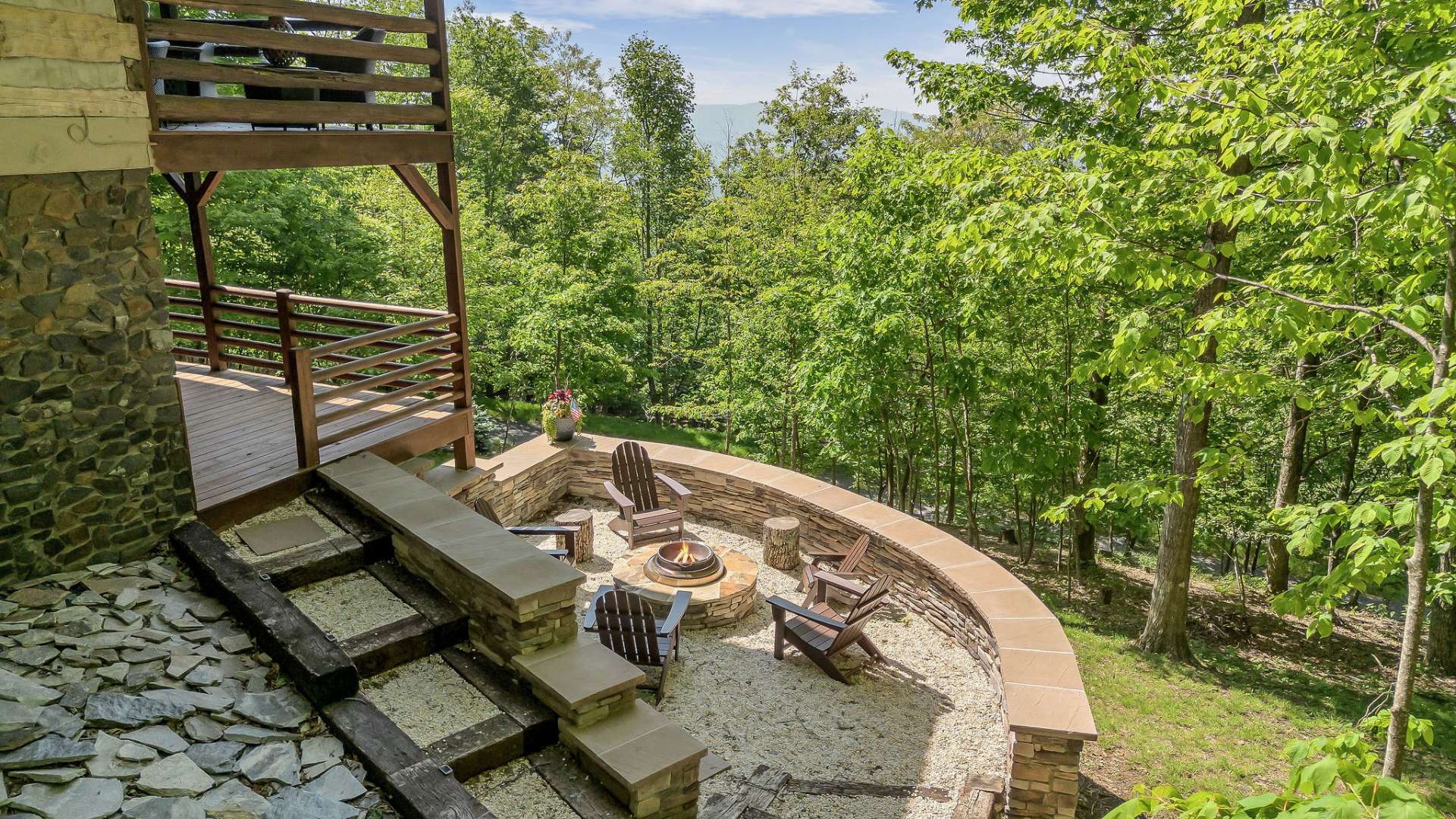 The lower deck extends to the newly added custom fire pit.