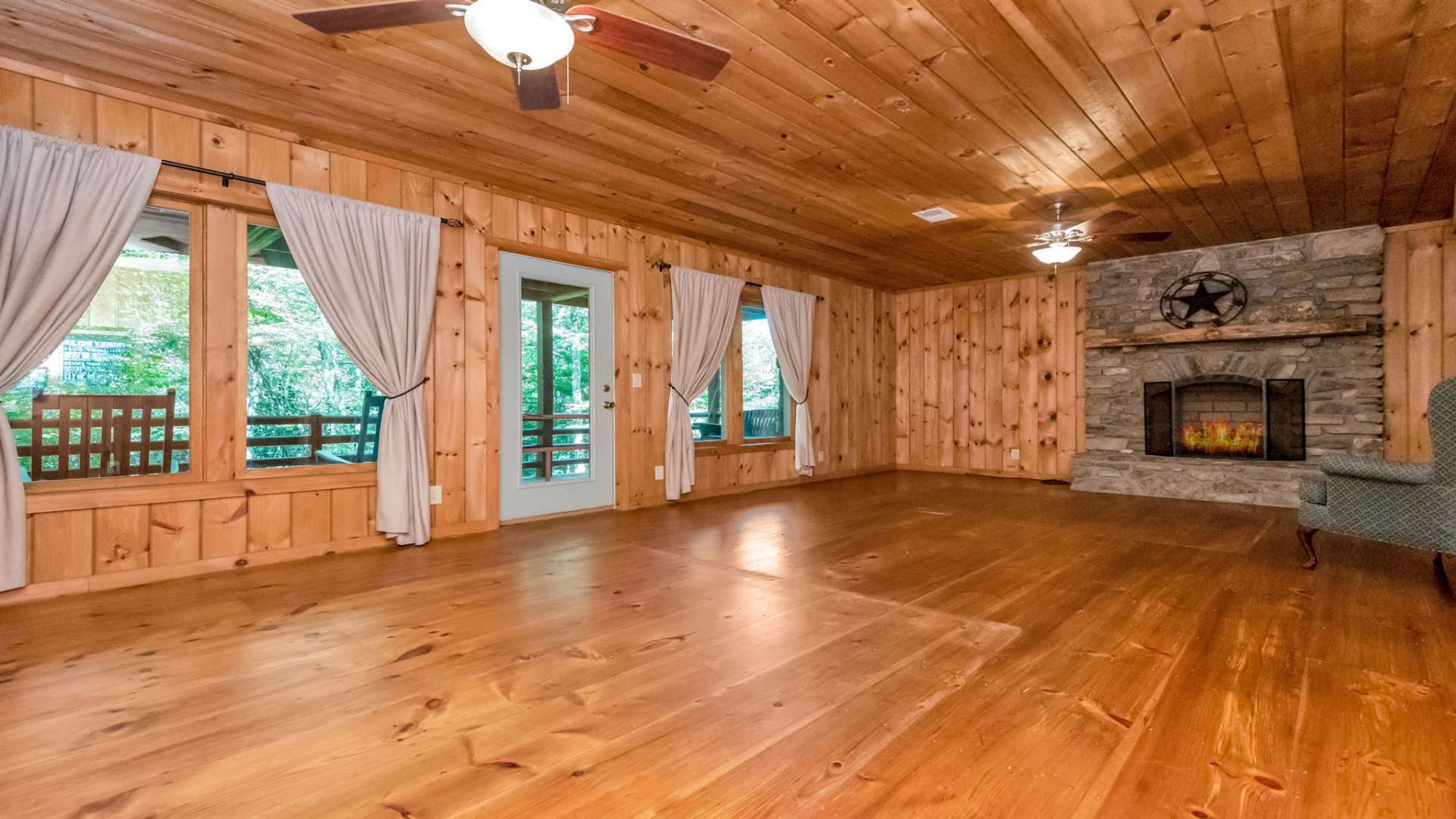 Walk out to the lower deck where you can enjoy the porch swing and the magical back yard.