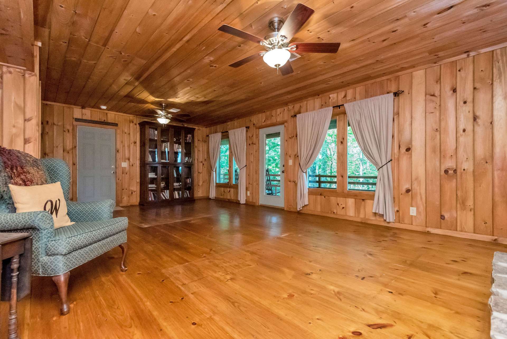 This room has good natural light and the back door leads to the oversized garage with storage and workshop space.