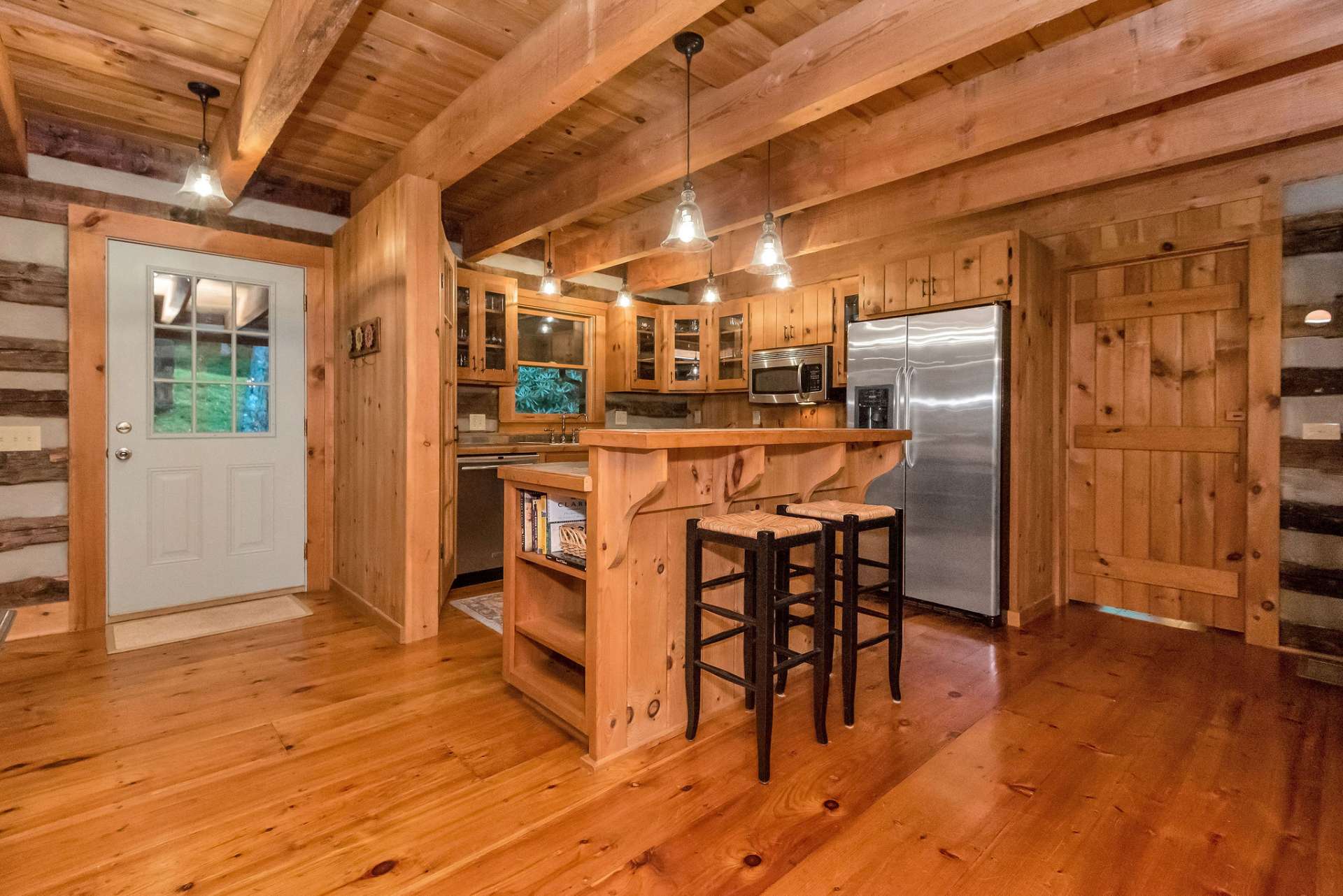 The kitchen features a breakfast bar with extra storage.