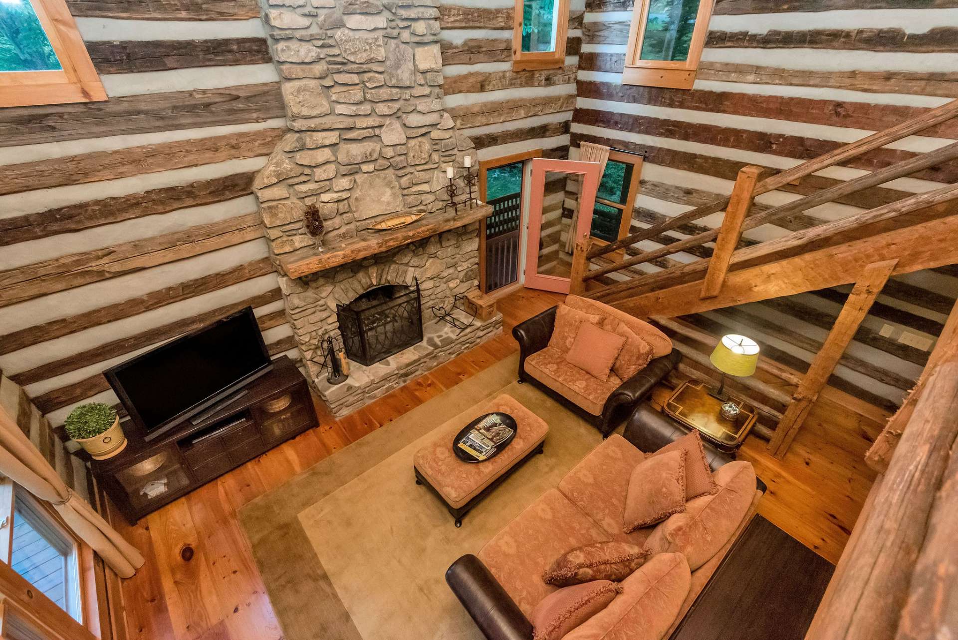 Beautiful hand hewn stairs lead you to the loft area.