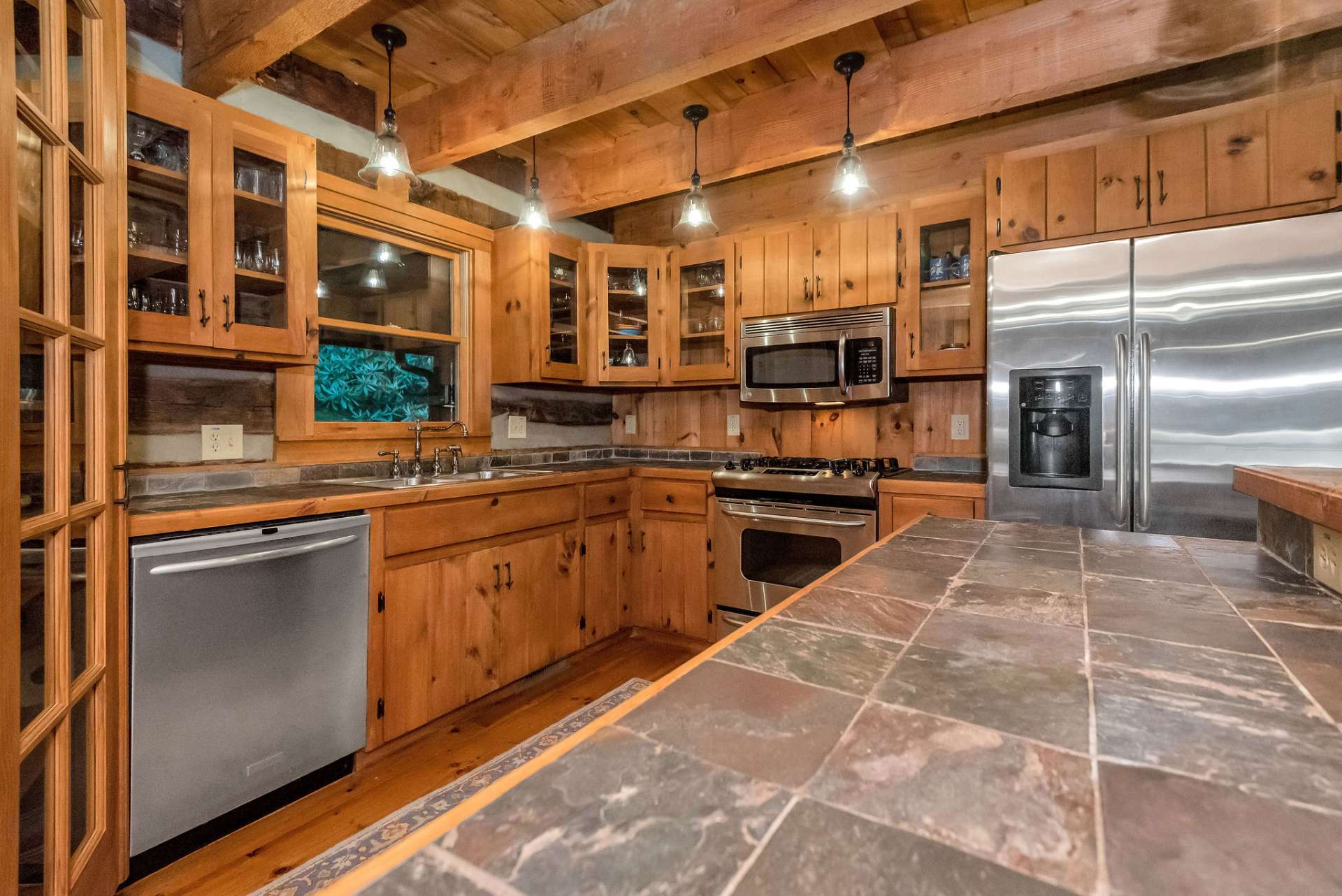 The glass door cabinets add an elegant touch.