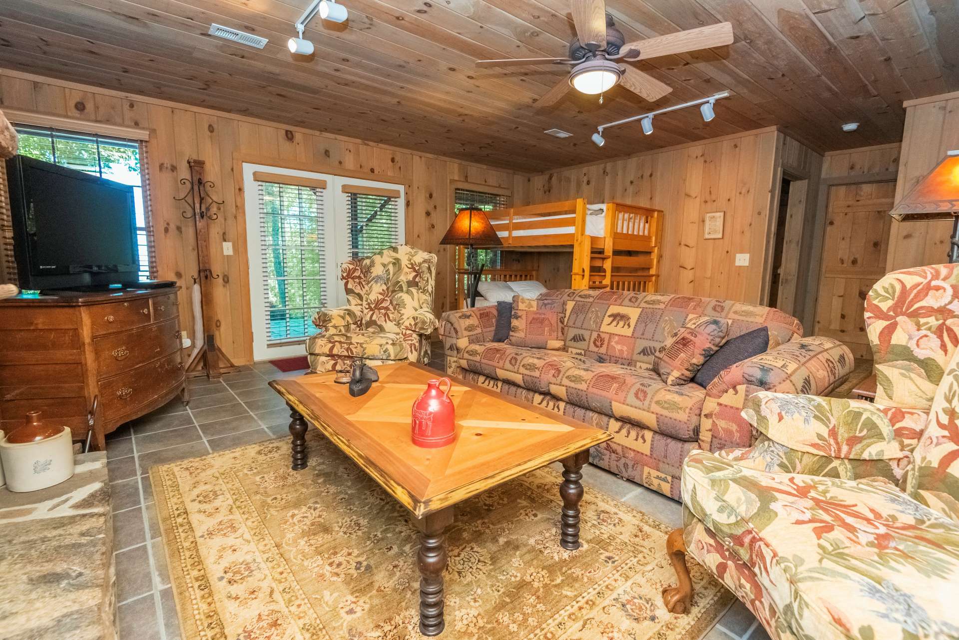 This lower level family room is the perfect hang out spot and flows to the outdoor patio and yard.