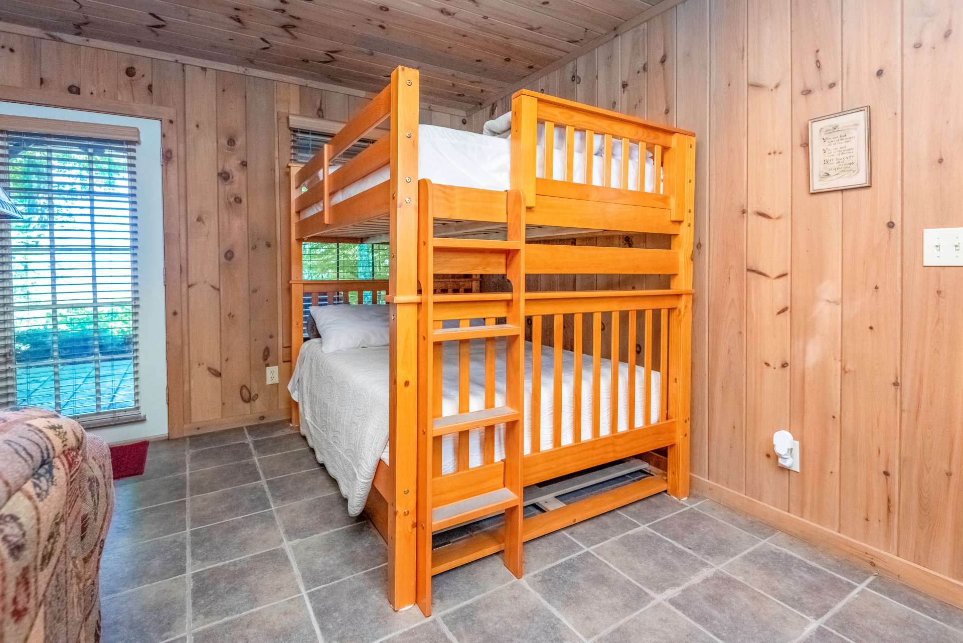Family room, not only has a futon, but also a bunk bed for additional sleeping space for overnight guests.