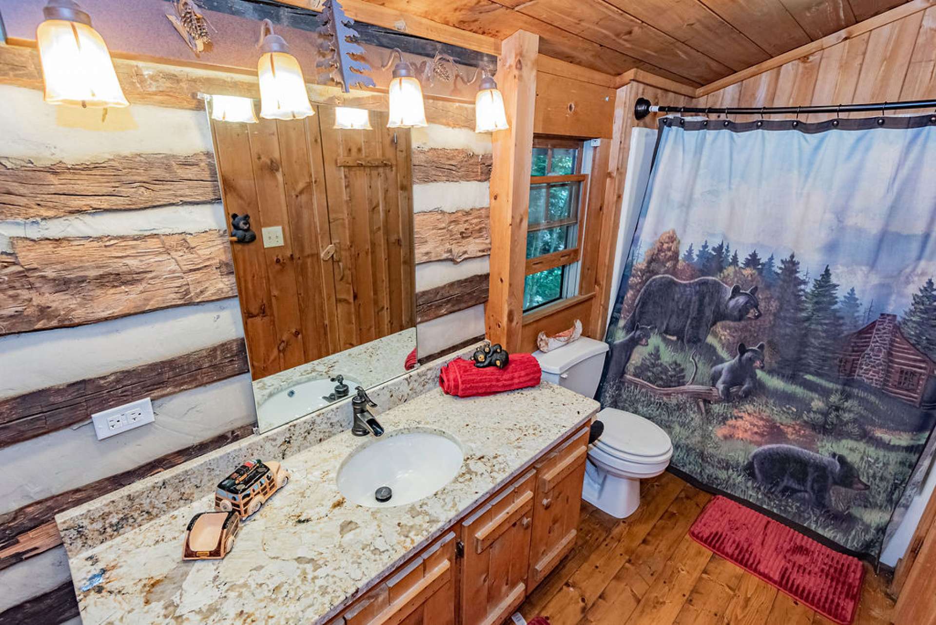 The two upper level guest bedrooms share a full bath.  You know you are in the mountains when you can hear the creek from the bathroom.