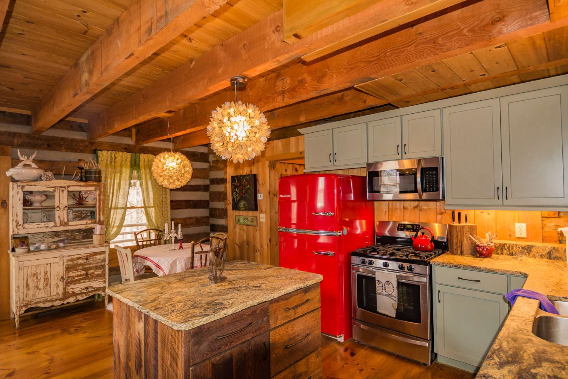 This beautiful cabin offers three levels of living space and over 1100 sq. ft. of decking and covered porch space for outdoor dining, entertaining, or simply relaxing.