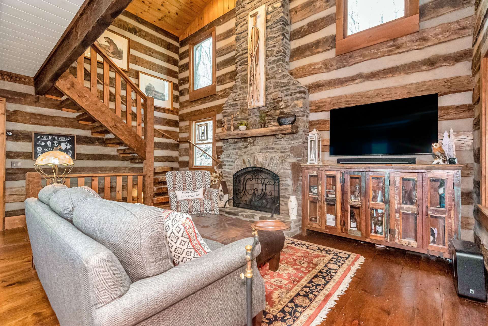 A majestic native stone fireplace reaches skyward, while keeping your evenings cozy and warm with gas logs.