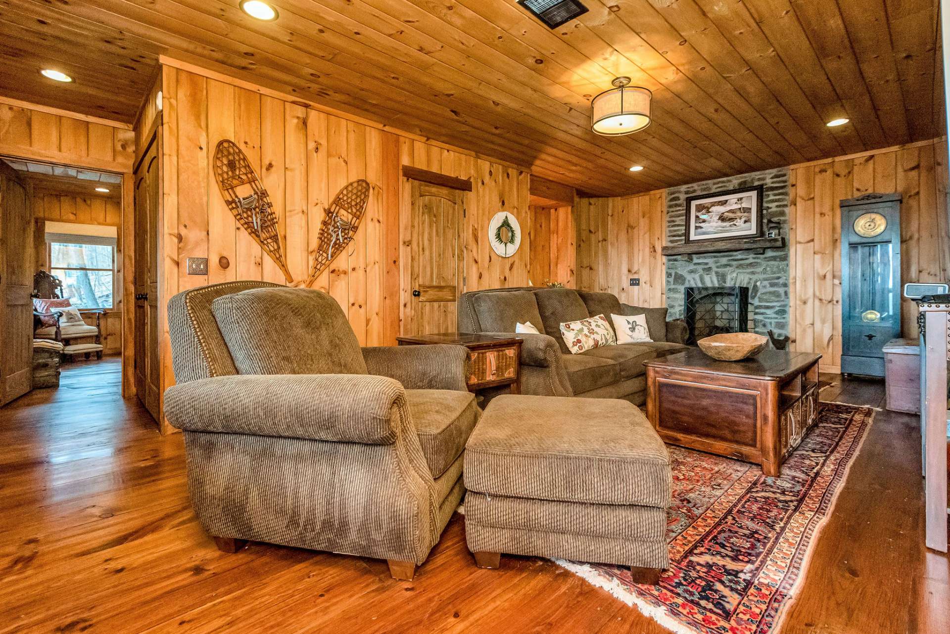 A second stone gas fireplace provides the coziness of cabin life into the lower level.