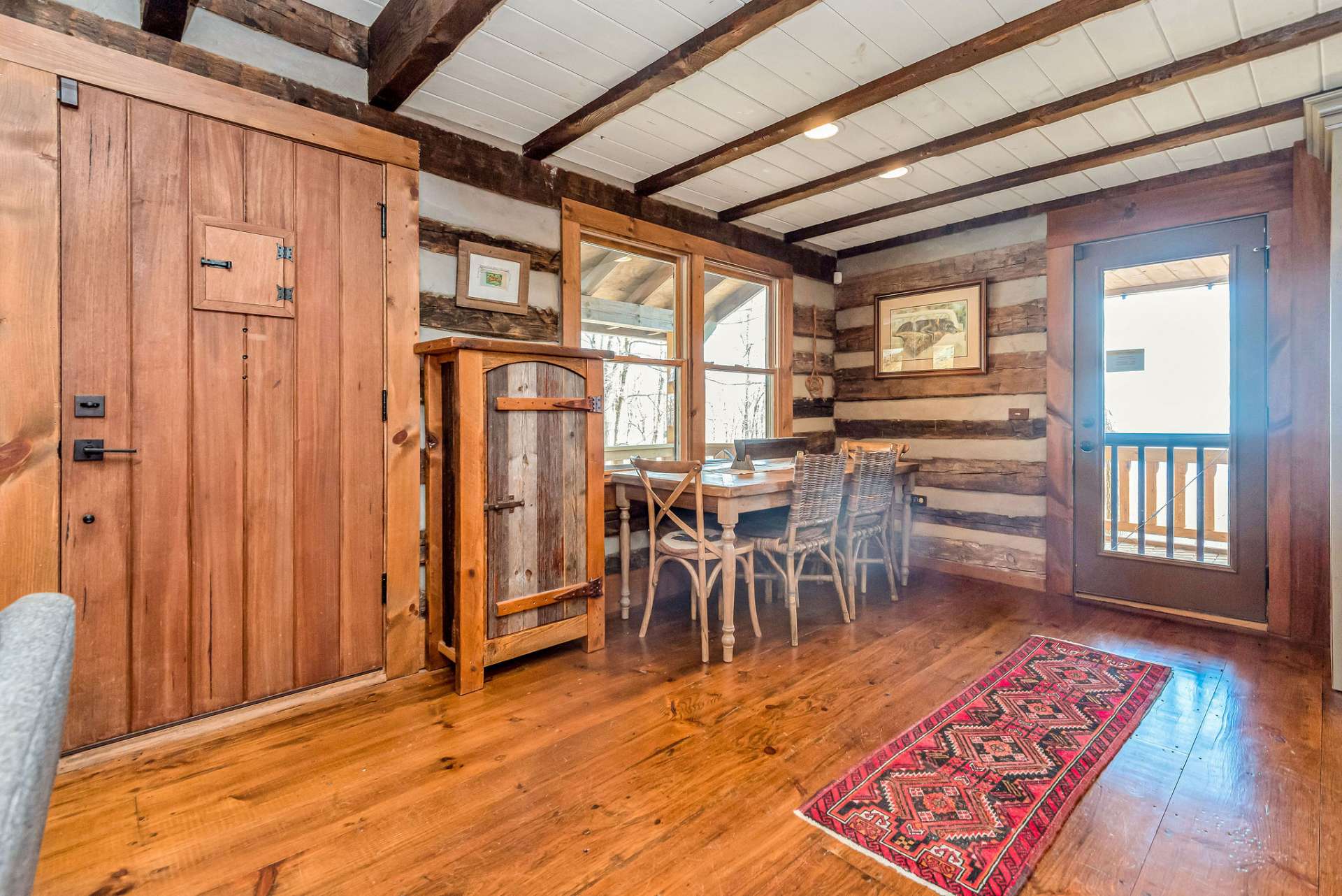 Each plank of the wide-pine flooring exhibits warmth and character, while the painted ceilings create an airy and spacious atmosphere.