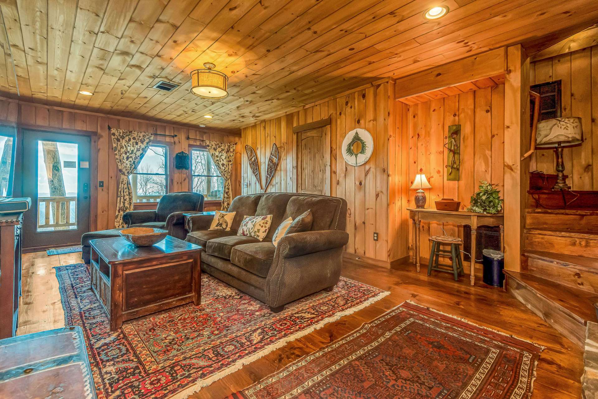 The lower level creates a cozy family room and peaceful haven for your guests with convenient access to the lower deck.