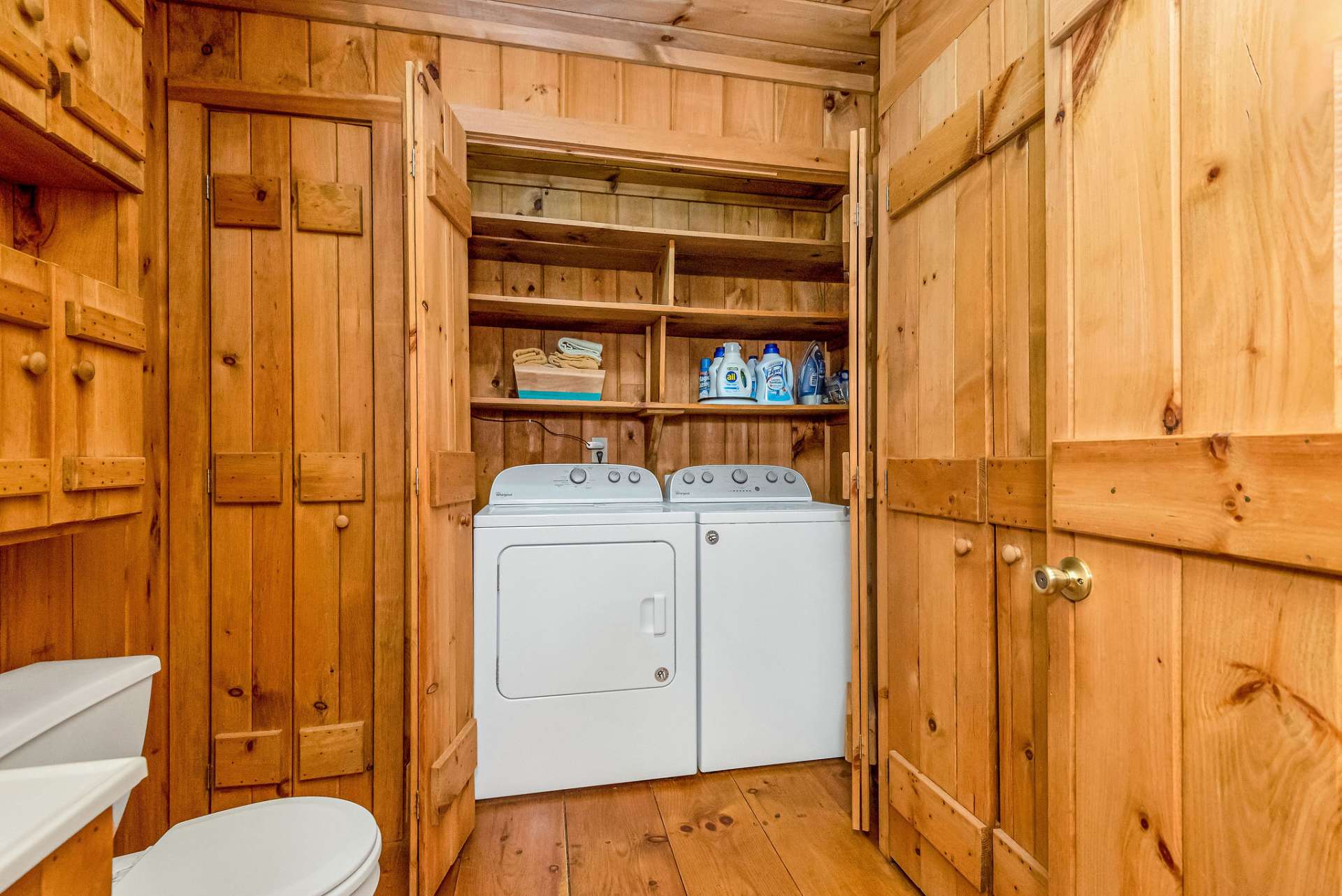 The laundry closet offers shelving for all your necessities at arm's length.