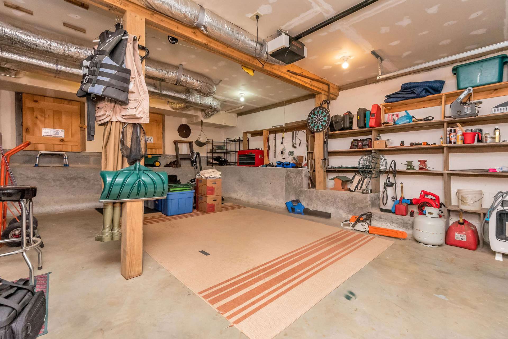 One car garage with room for workshop and additional storage in the back.