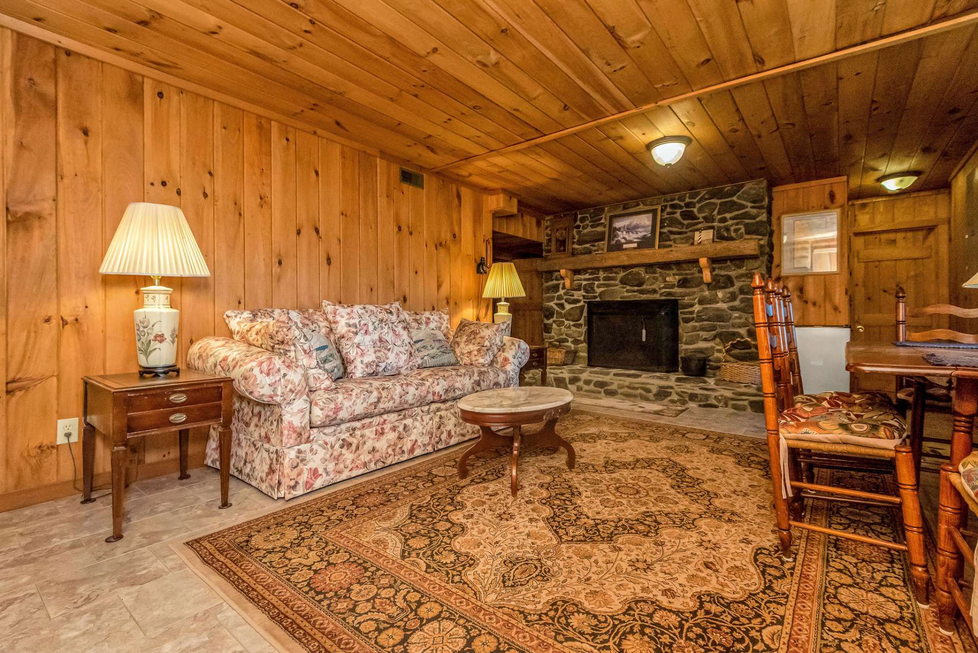 Lower level family room with gas fireplace is perfect for extended stays or cozy gatherings.