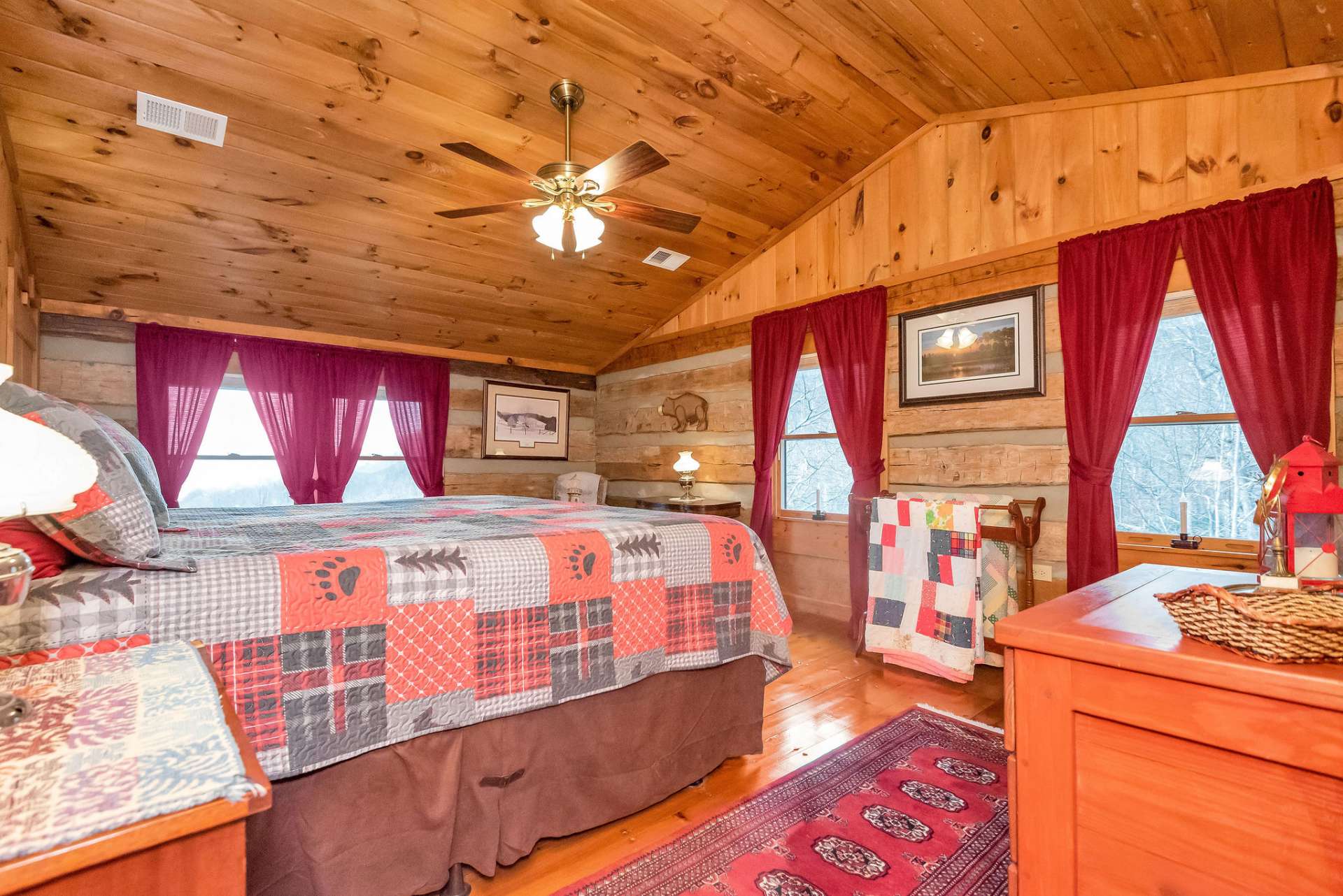Additional guest room with vaulted ceilings, views, and natural light.