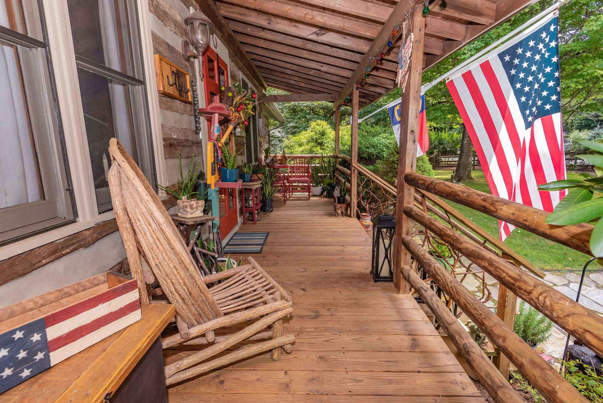 A covered wraparound front porch is warm and inviting.