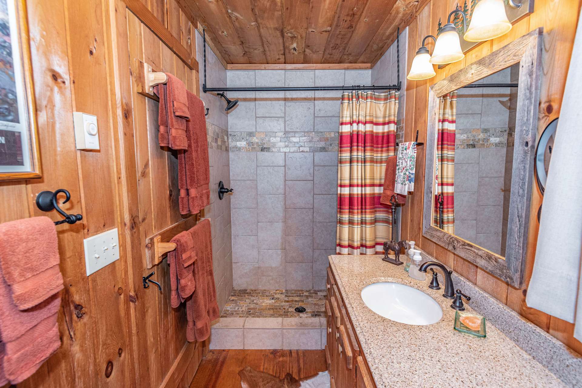 Main bath has easy access tiled walk-in shower. A full size washer and dryer is conveniently situated in bathroom.