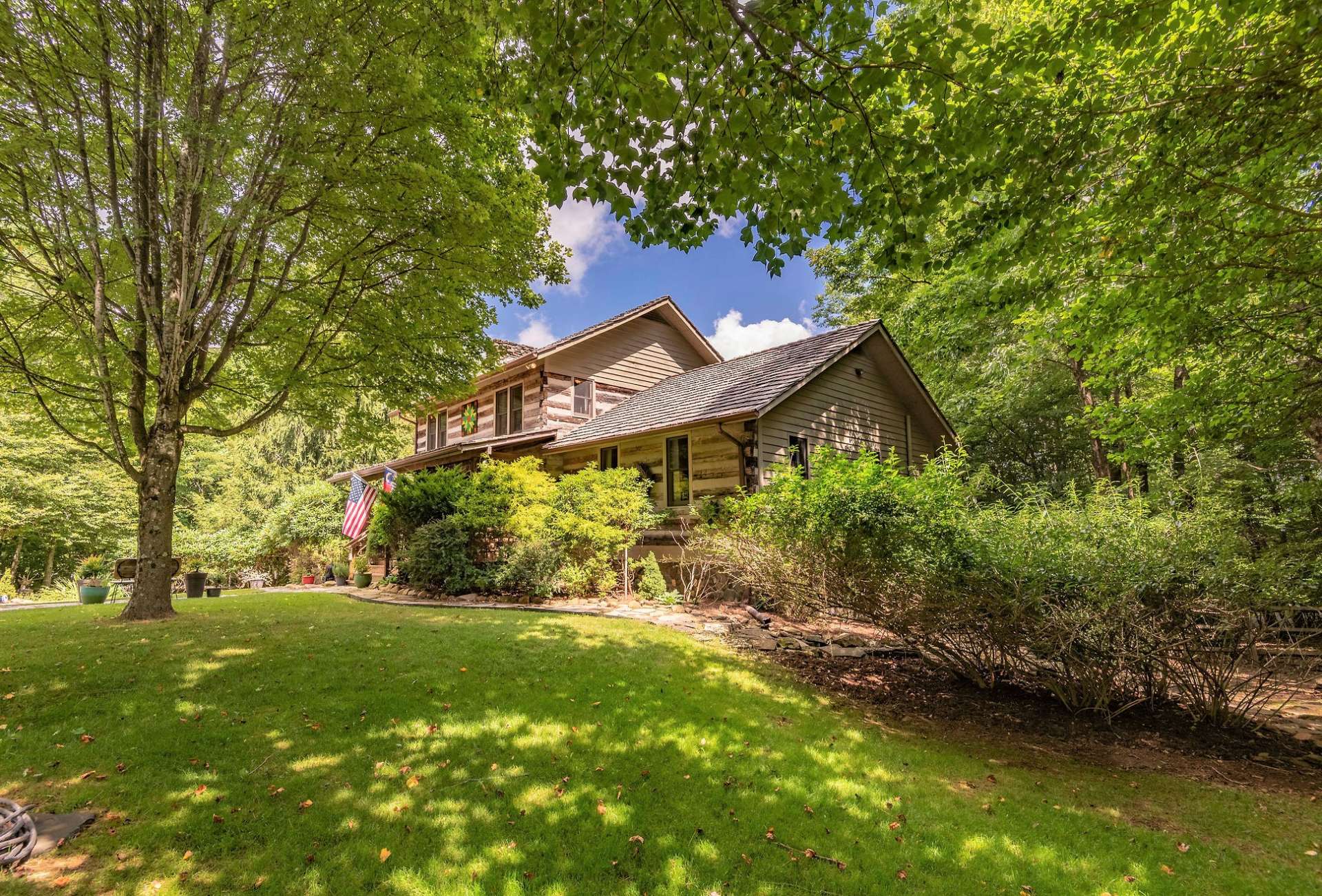 This level and fenced yard is the perfect play area for children and pets. Enjoy easy to maintain landscaping with beautiful rhododendrons and forsythia bushes.