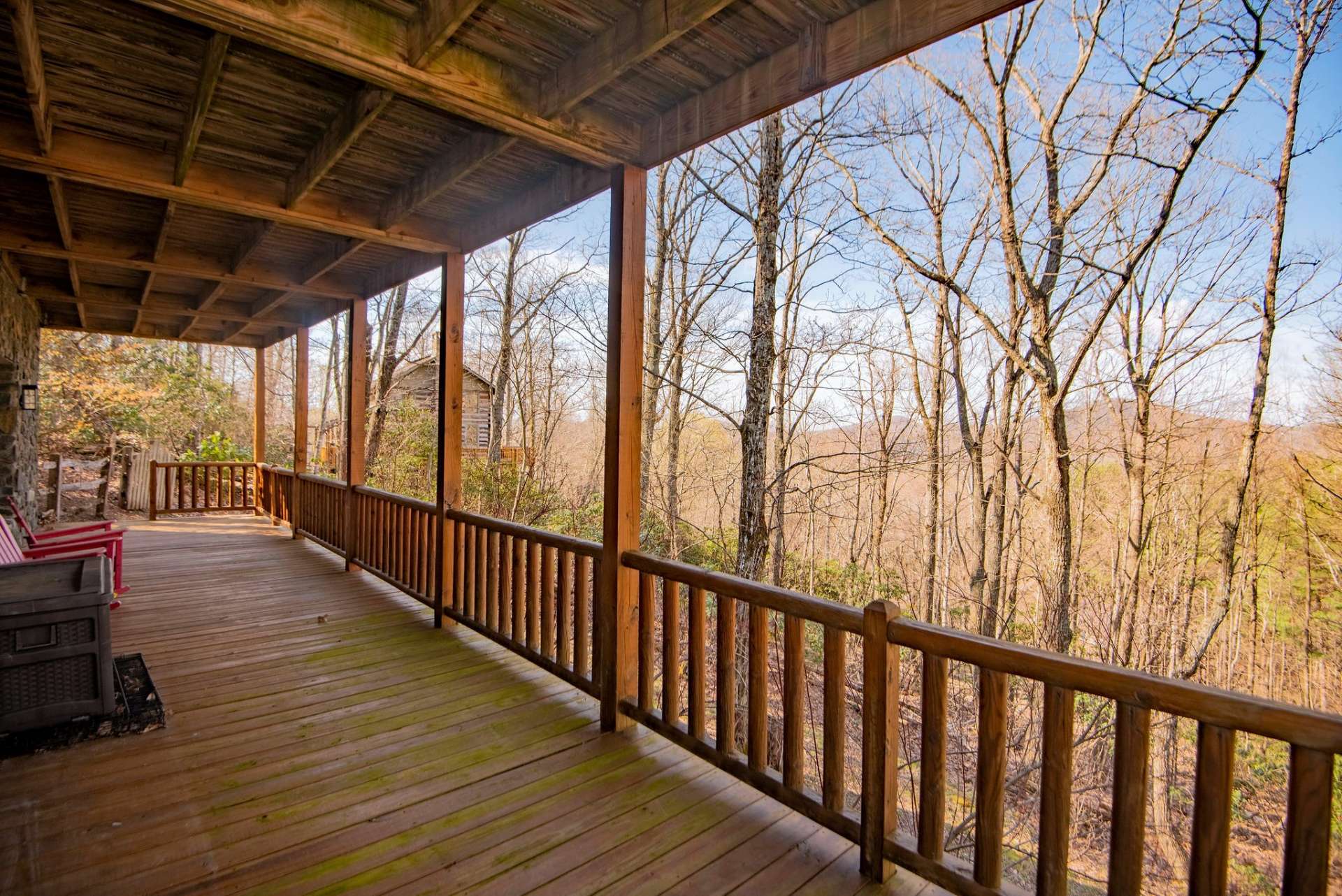 Lower deck leads to a partially fenced back area that could be set up for pets.  This rustic antique log cabin nestled in a wooded setting in Stonebridge is offered mostly furnished.