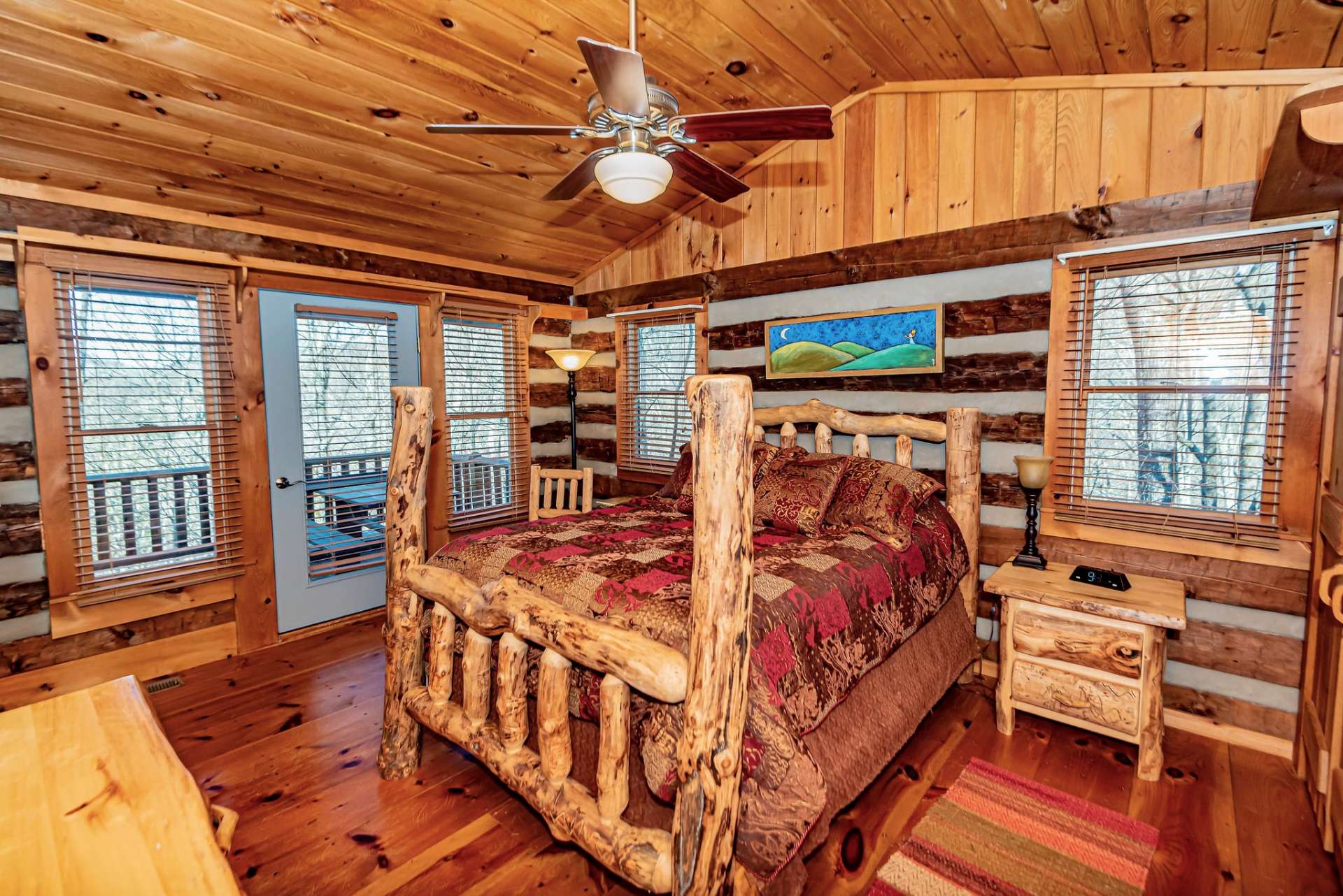The main level bedroom has convenient access to the open deck.