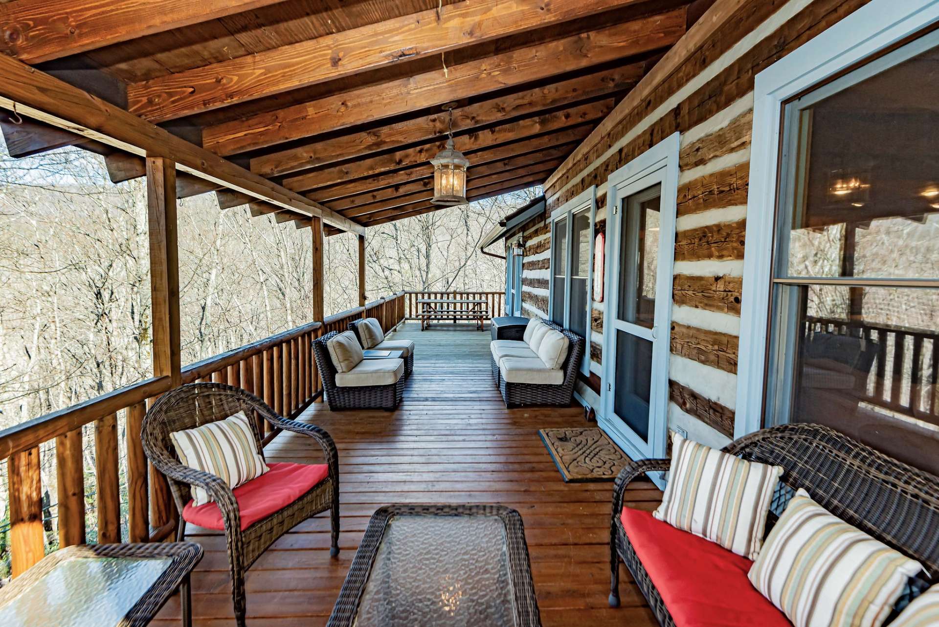 The main level porch has both covered and open areas to take advantage of the beautiful outdoor living space.
