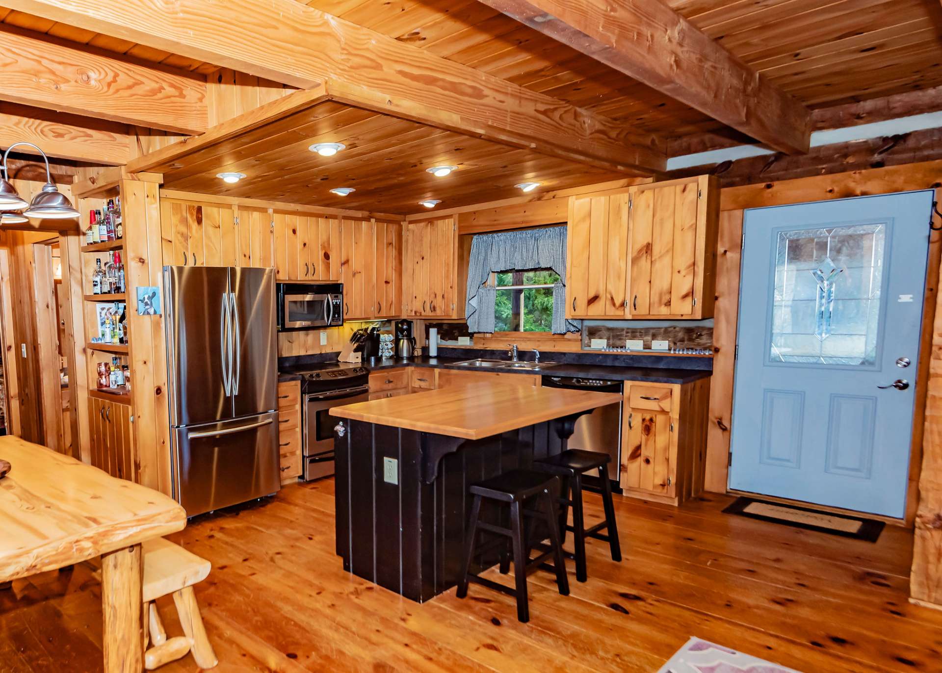 Convenient kitchen island has bar seating as well as extra storage.