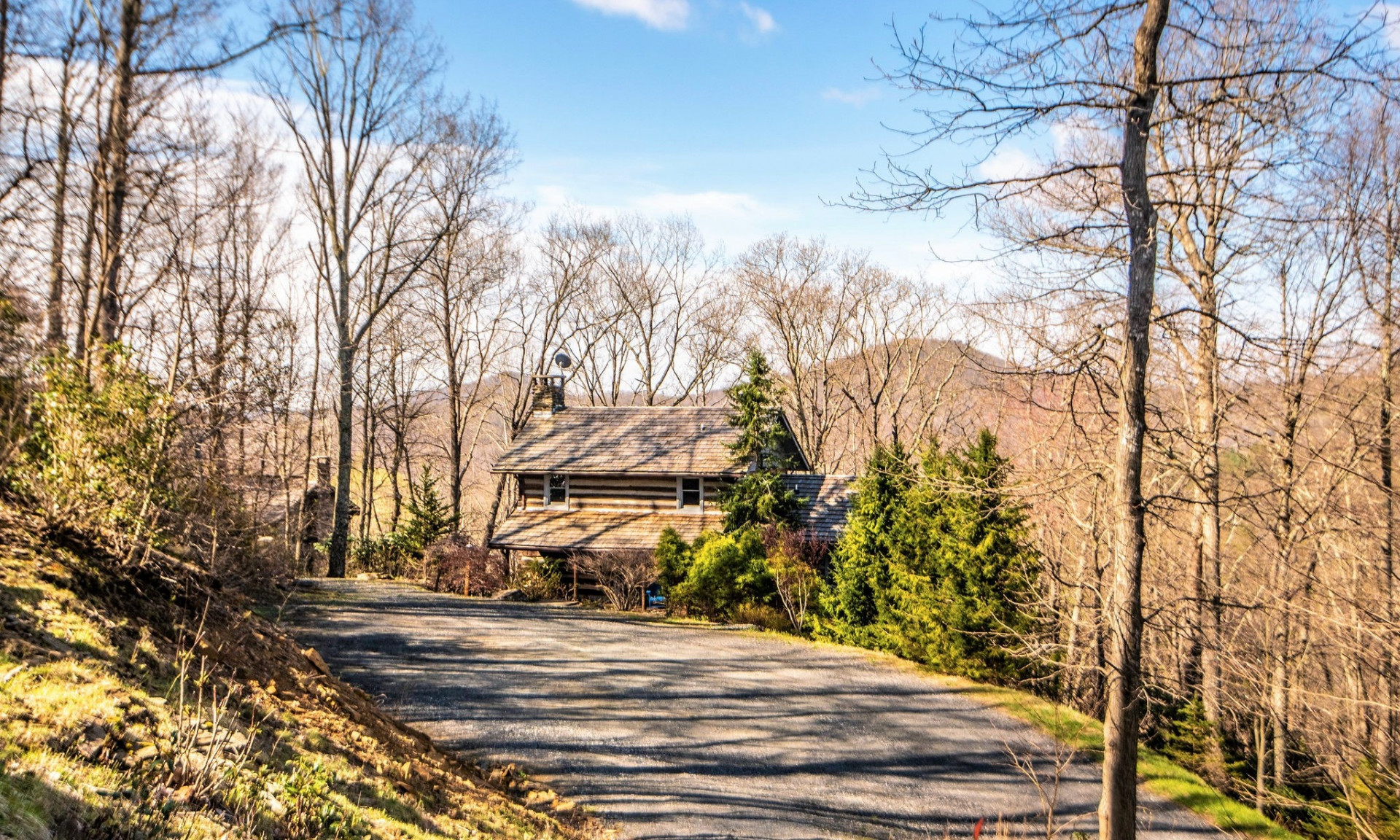 This charming 2 bedroom plus loft, 3 bath antique log cabin in Stonebridge is ideally situated with end of the road privacy.