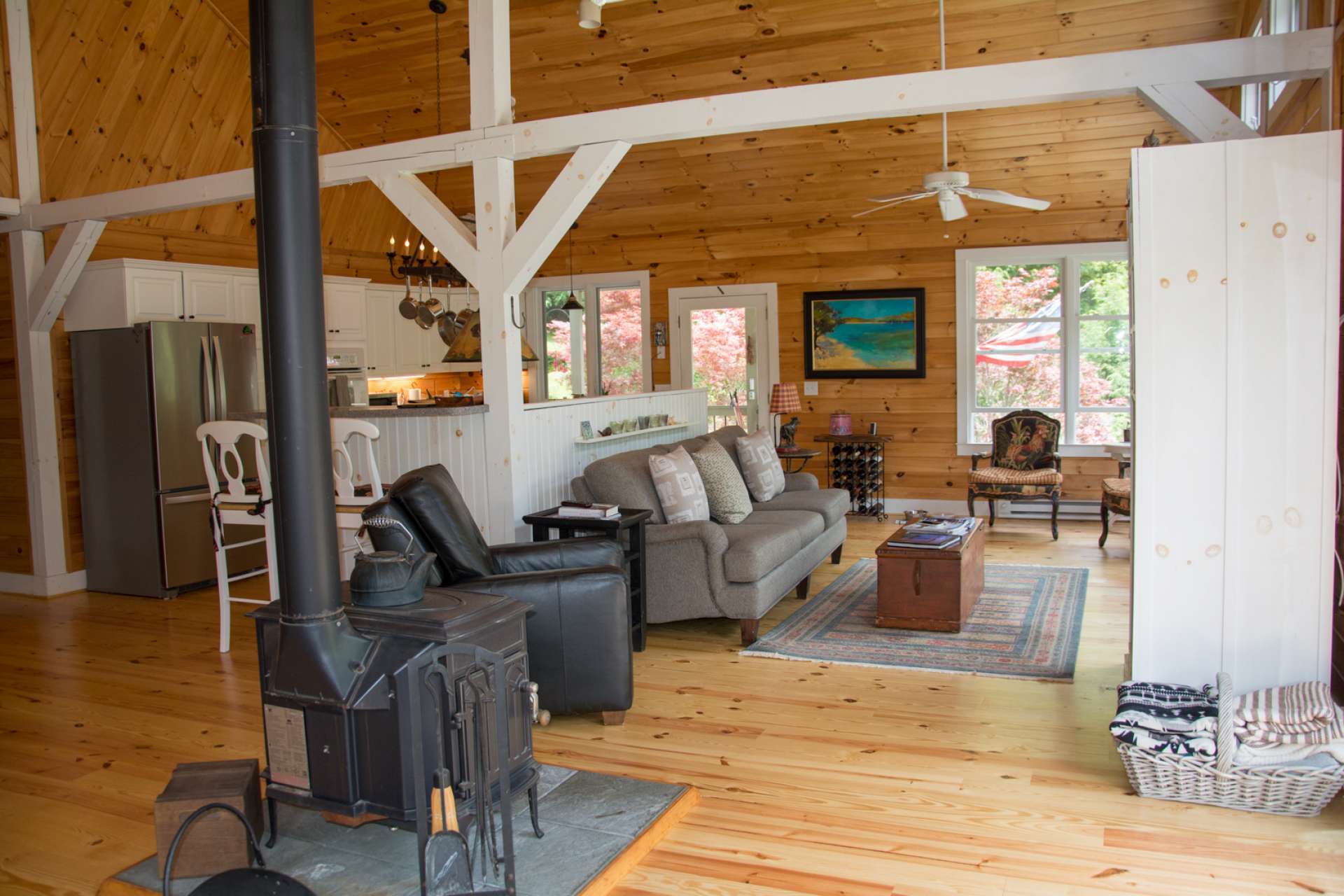 The main home is both elegant and rustic offering wood floors and vaulted tongue and groove ceilings.