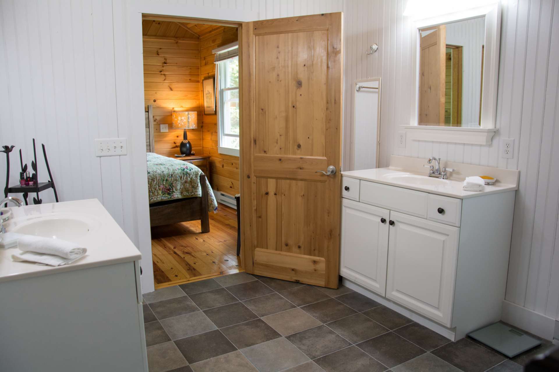 The master bath features separate vanities and a large walk-in tiled shower.