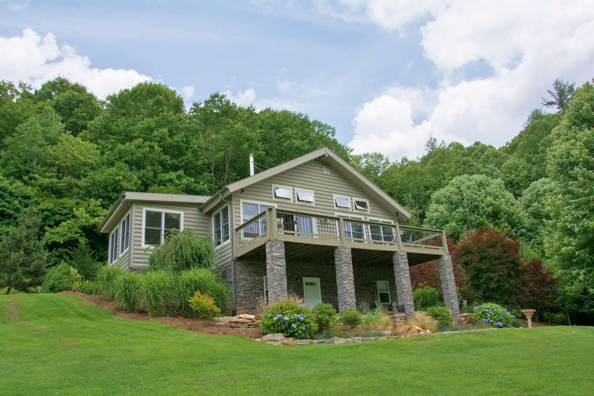 The main level offers a large open deck with plenty of room for outdoor entertaining.