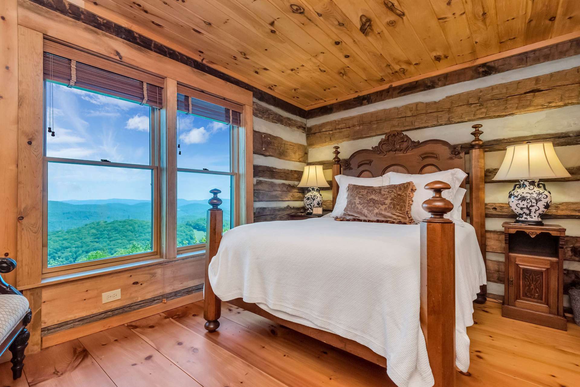 Guest bedroom on upper level includes the same incredible long range view.