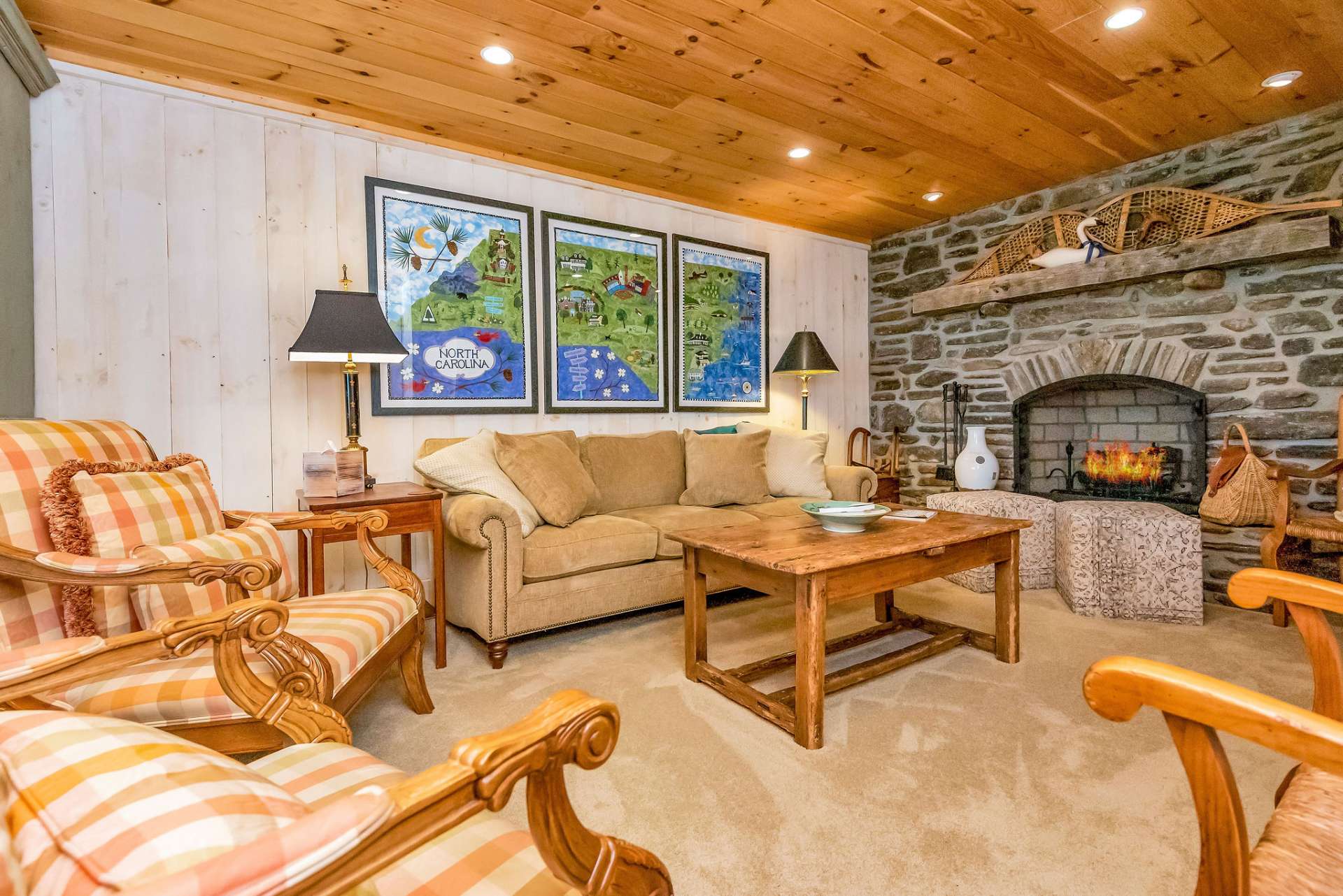 The lower level provides yet another family room which, of course, features another stone fireplace, this one with gas logs.