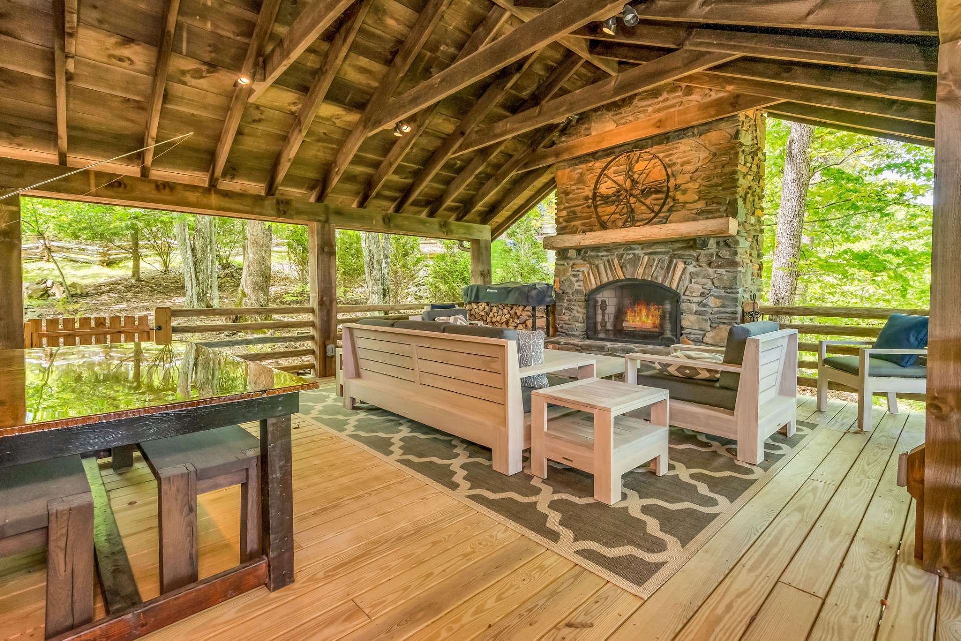Plenty of space for outdoor dining and entertaining or simply relaxing by the wood-burning fireplace on cool summer evenings in the Blue Ridge Mountains.