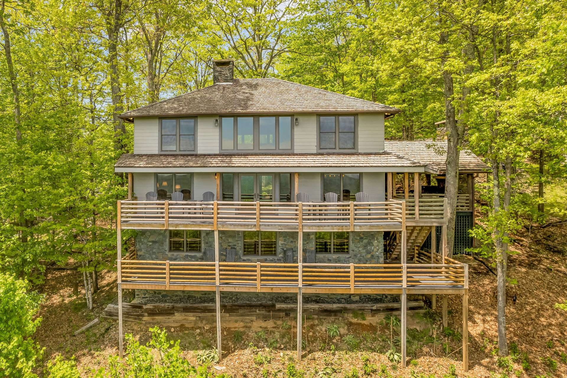 Enjoy the great outdoors and the fresh mountain air from either of the full length decks on the back of the cabin, with both decks providing access to the covered deck on the side which features an outdoor fireplace.