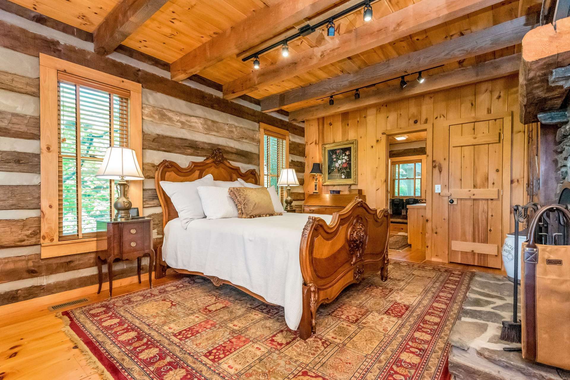 This spacious, main level master suite is as inviting during daytime as it is after dark.