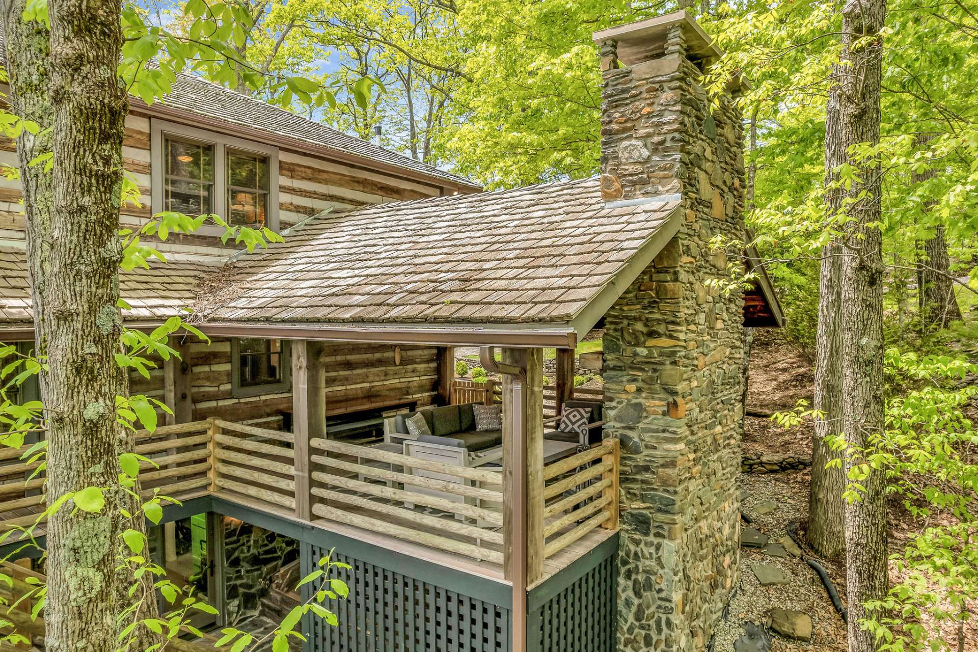 Owners had this 618 sq. ft. covered deck constructed using materials & finishes to match the cabin.