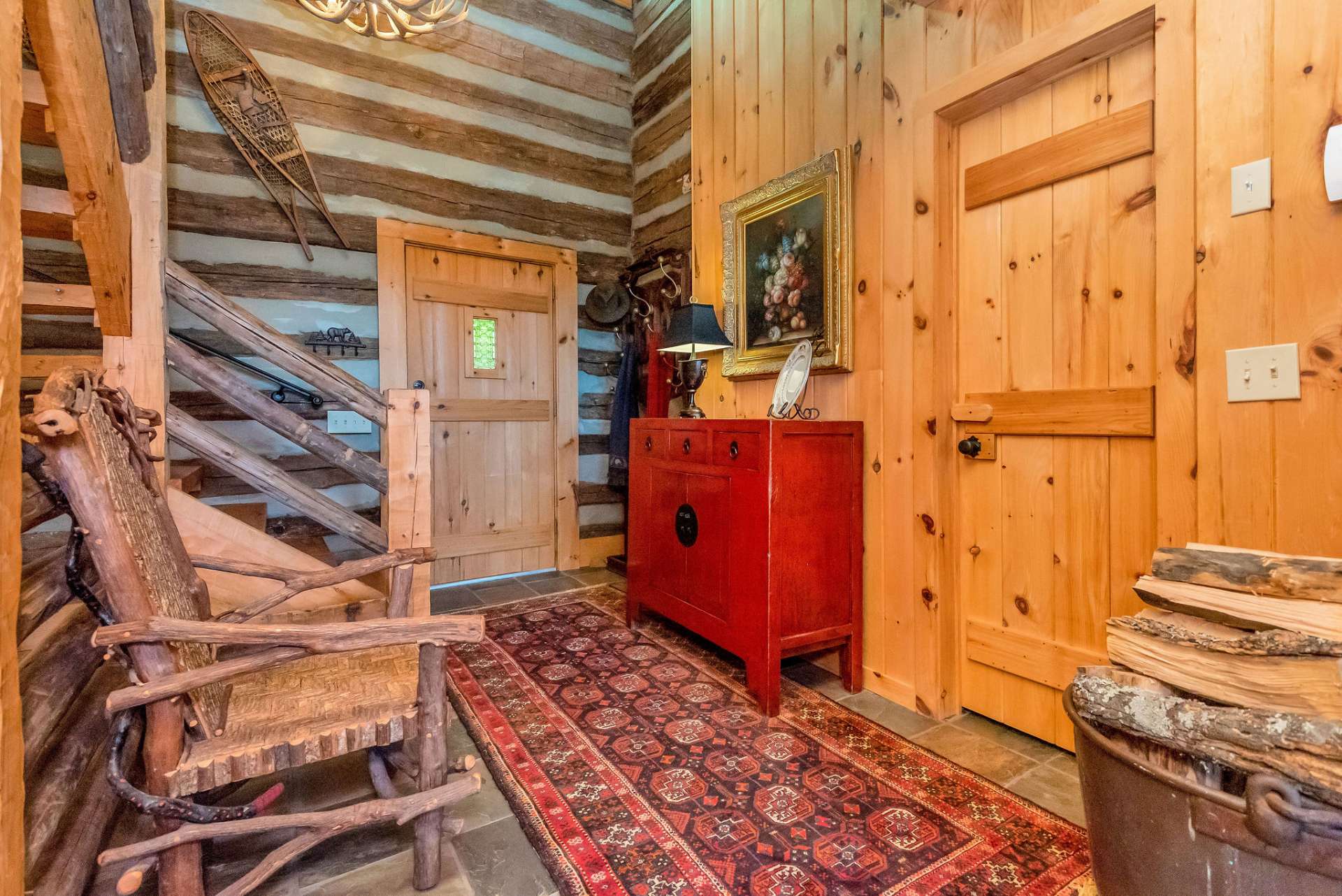 Greet family and friends in the 2-story foyer which leads to all three levels of this unique cabin.