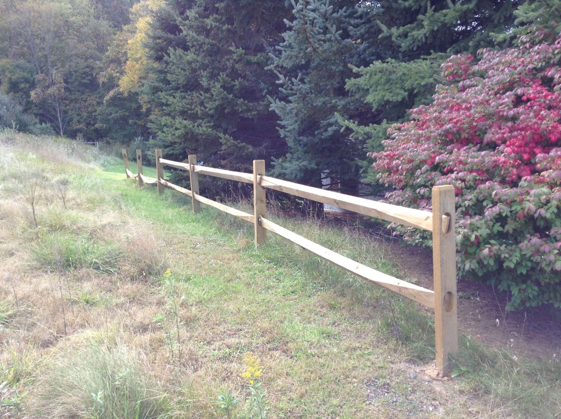 This photo provided by the owner shows a fence that runs up the land near the gate.