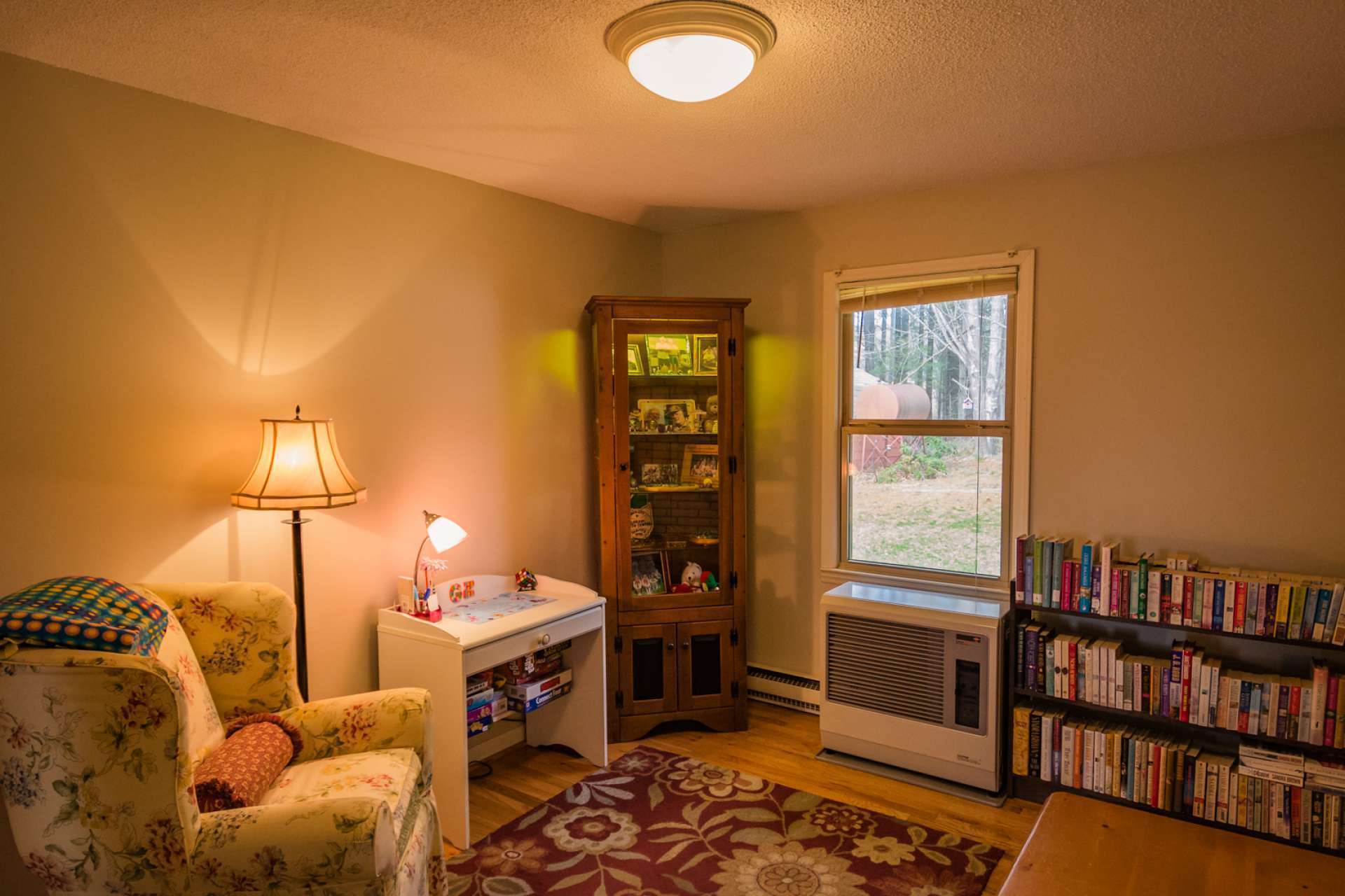 The den area offers a relaxing place to spend time with family and friends, or expand the entertaining space.