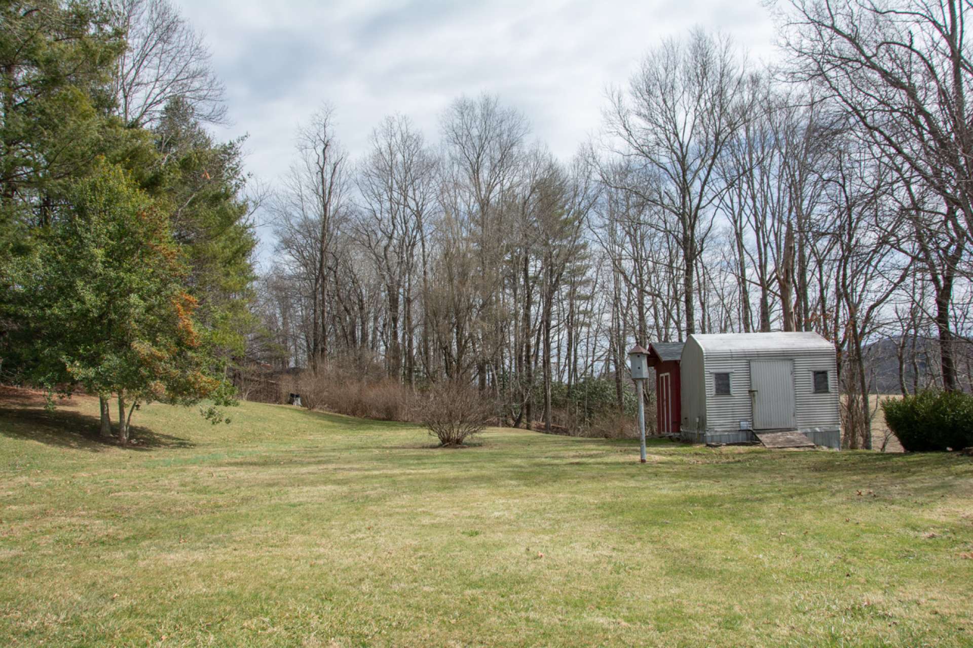 Beautiful back yard... nice & level with plenty of space for children, pets and/or gardening. Two outbuildings included.