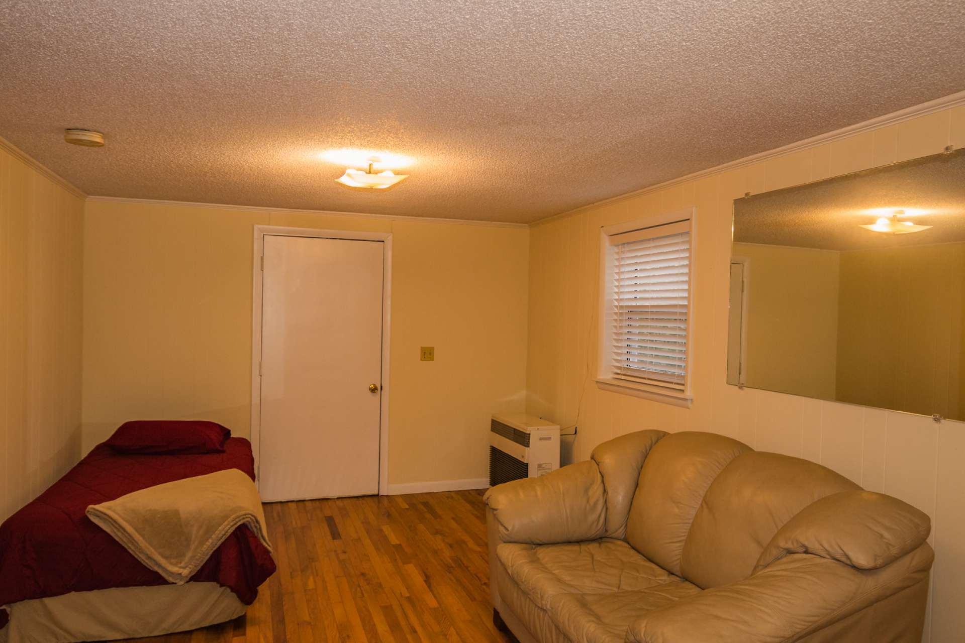 The full finished walk-out lower level features a family room, game room, bonus room, and laundry area.